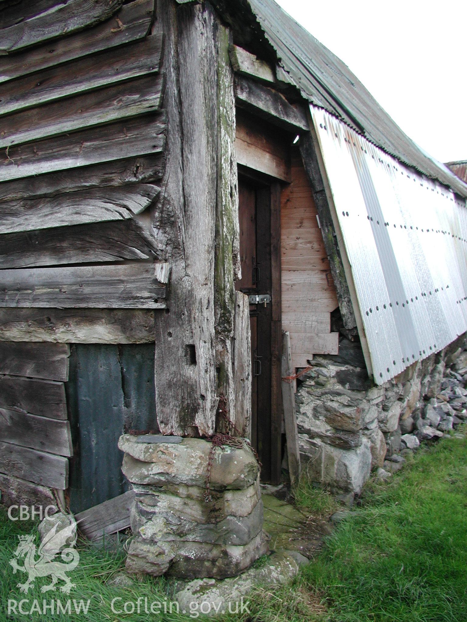 Exterior view of shed or barn at Pistyll Gwyn Farmstead showing wood panelling, stone wall and corrugated iron roof. Photographic survey of Pistyll Gwyn Farmstead conducted by Geoff Ward on 13th November 2007.