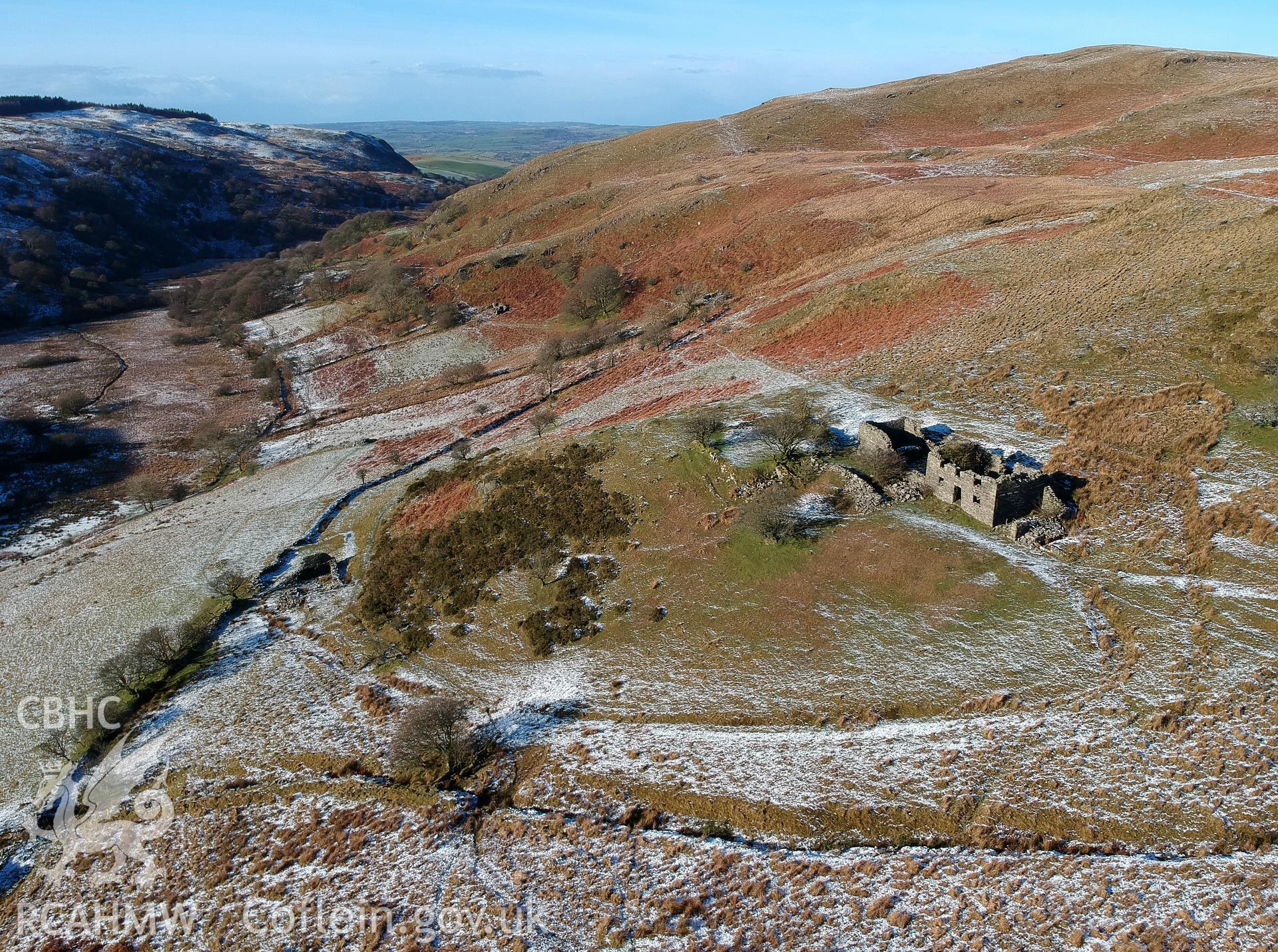 Aerial view of deserted, roofless, dry-stone walled Ty-Canol house and the associated farmstead, Creigen Ddu. Colour photograph taken by Paul R. Davis on 17th January 2019.