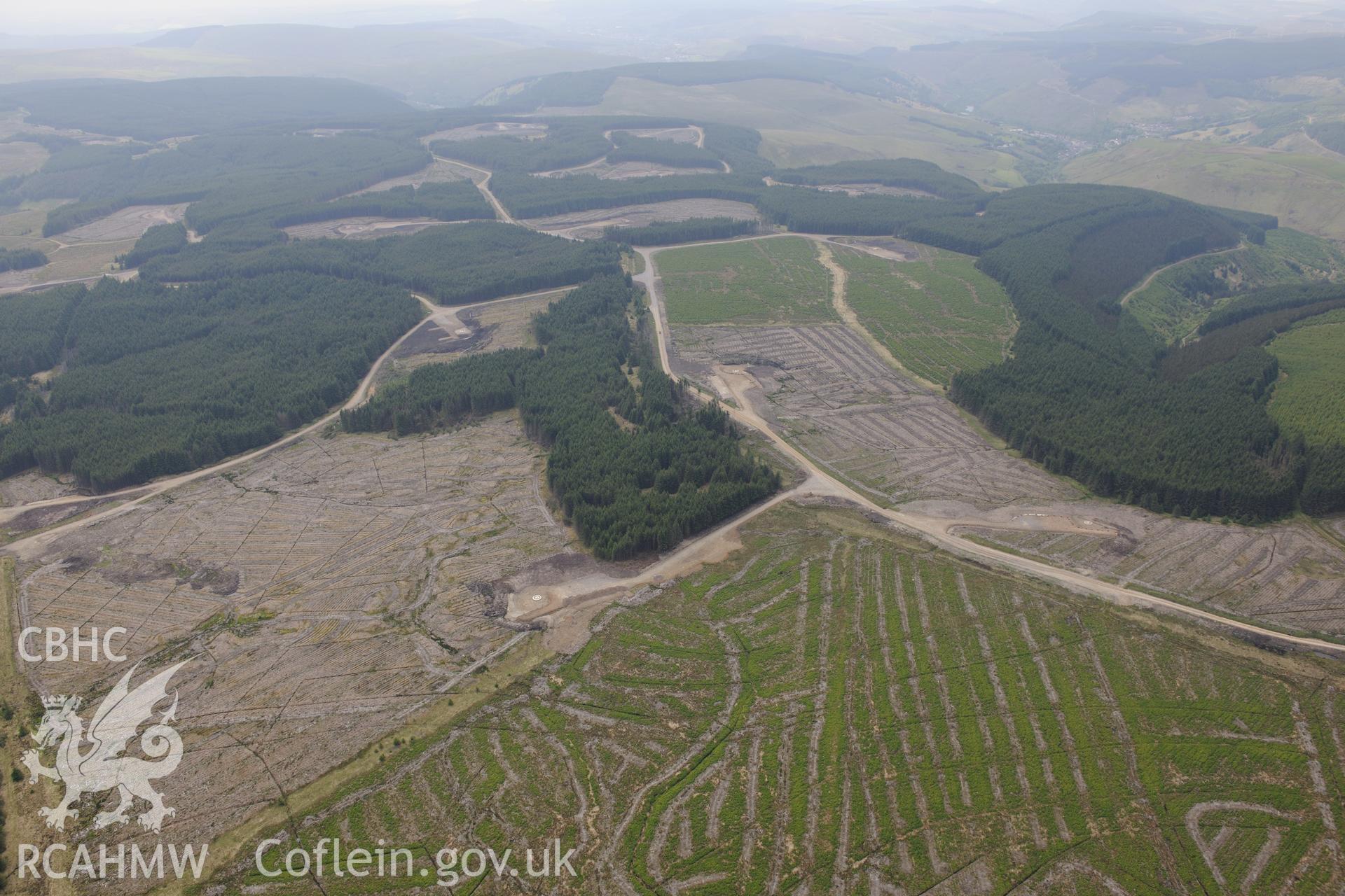 Pen y Cymoedd wind farm under construction before officially opening in September 2017.  Oblique aerial photograph taken during the Royal Commission's programme of archaeological aerial reconnaissance by Toby Driver on 11th June 2015.