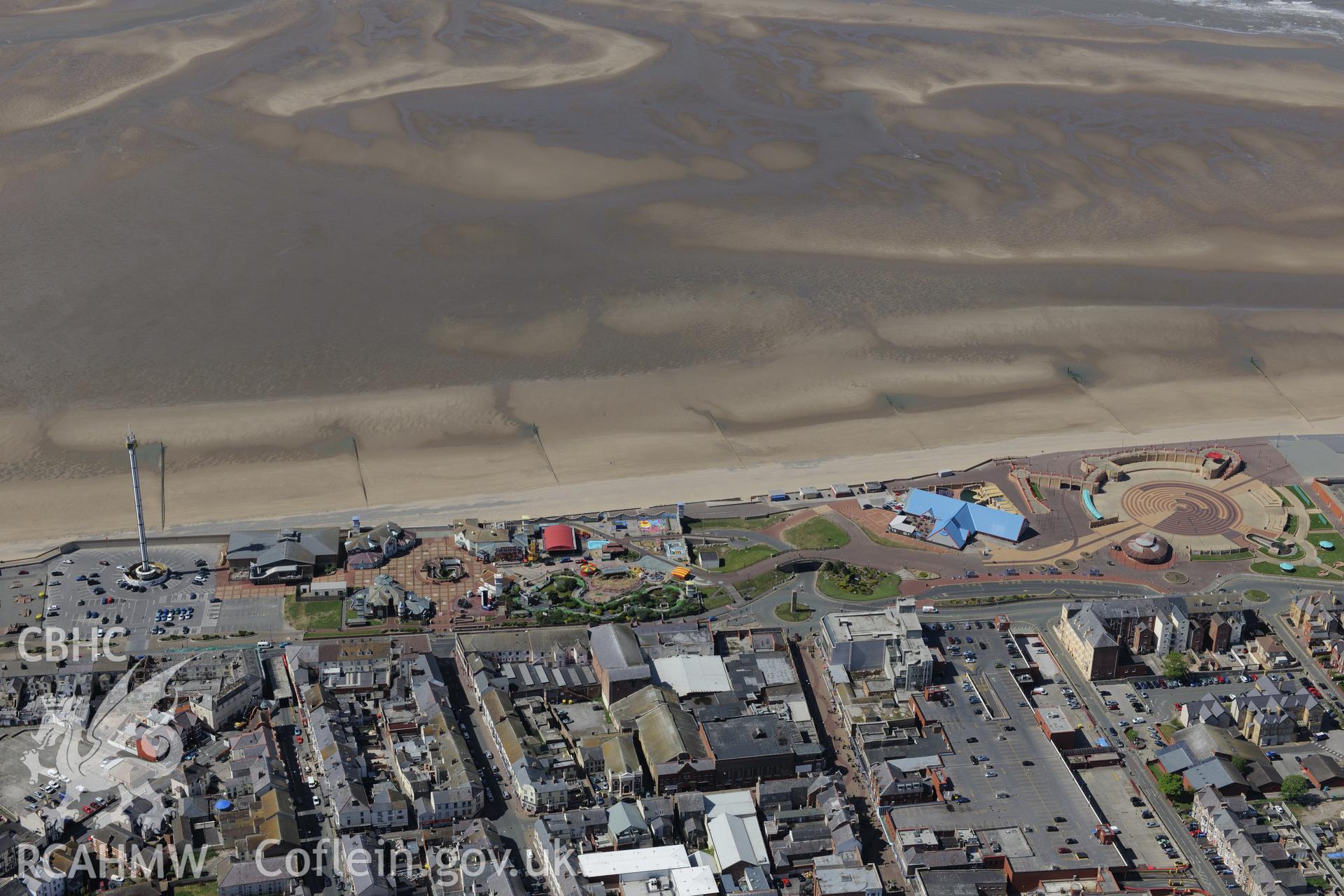 Rhyl and its promenade. Oblique aerial photograph taken during the Royal Commission?s programme of archaeological aerial reconnaissance by Toby Driver on 22nd May 2013.