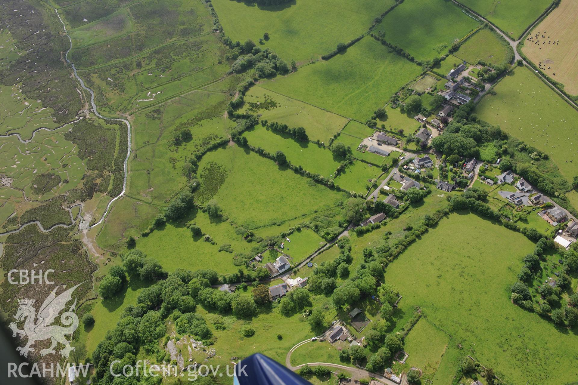 Landimor Castle; Landimore Farm and Cheriton shrunken village. Oblique aerial photograph taken during the Royal Commission's programme of archaeological aerial reconnaissance by Toby Driver on 19th June 2015.