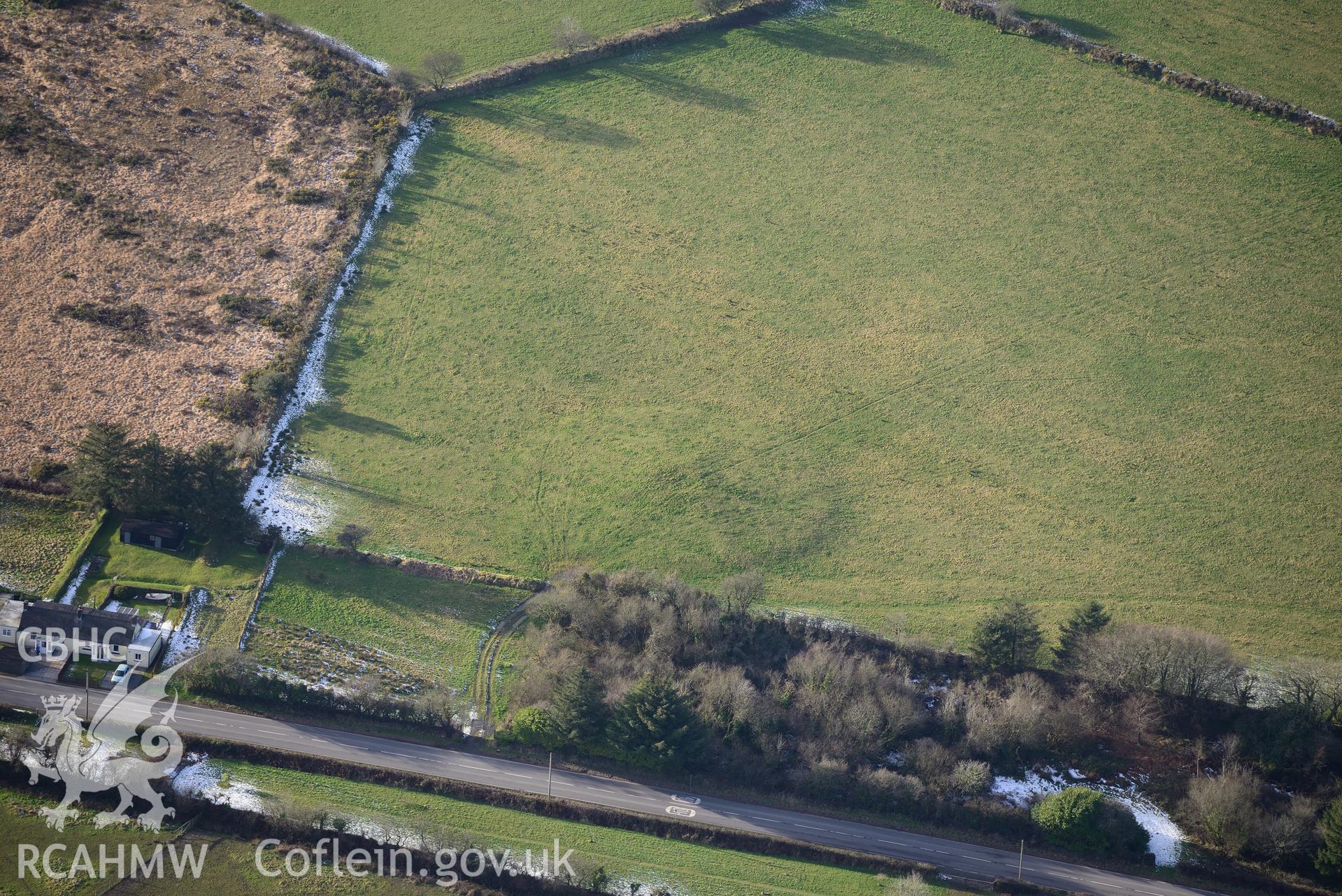 Precelly Farm barrow, south west of Glandy Cross, near Narberth. Oblique aerial photograph taken during the Royal Commission's programme of archaeological aerial reconnaissance by Toby Driver on 4th February 2015.