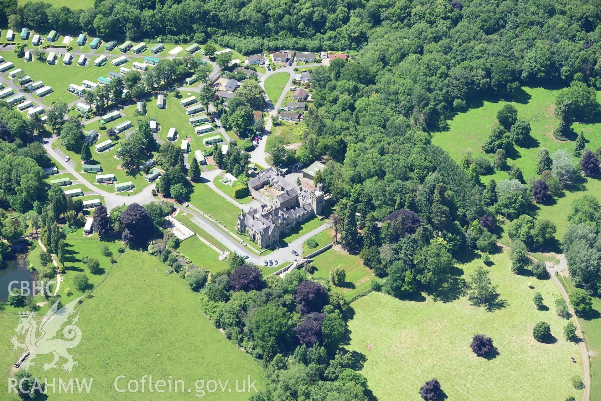 Mellington Hall, it's garden and the section of Offa's Dyke that runs through its grounds. Oblique aerial photograph taken during the Royal Commission's programme of archaeological aerial reconnaissance by Toby Driver on 30th June 2015.