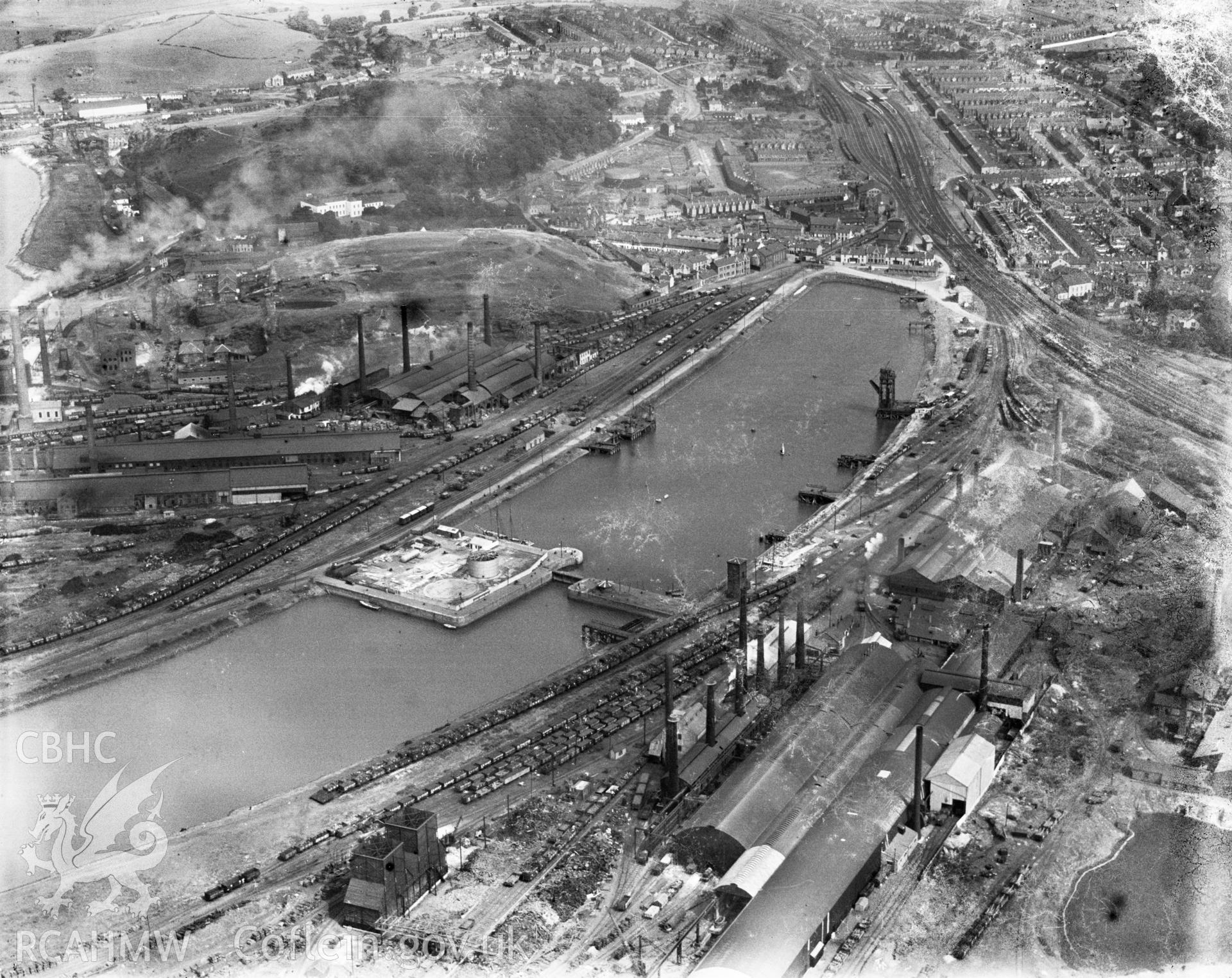 View of Briton Ferry showing the docks and steelworks, oblique aerial view. 5?x4? black and white glass plate negative.