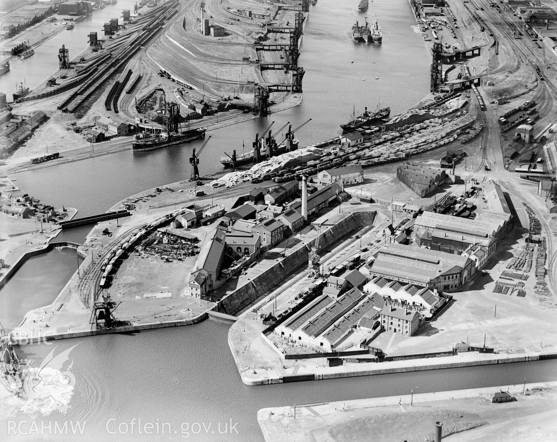 View of C.H. Bailey Ltd., dry dock owners & ship repairers and surrounding dockyard, Cardiff, oblique aerial view. 5?x4? black and white glass plate negative.
