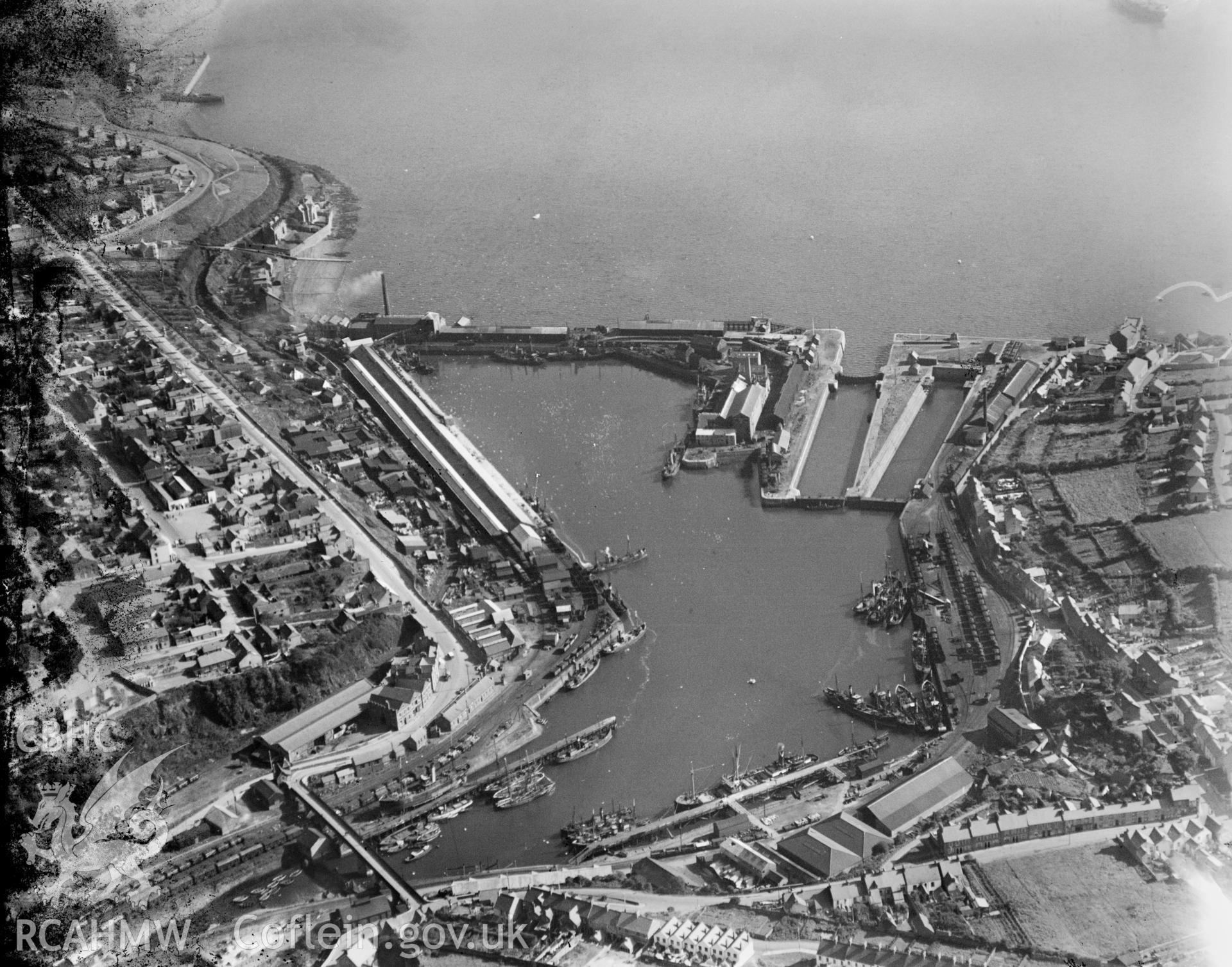 View of Milford Haven and docks, oblique aerial view. 5?x4? black and white glass plate negative.