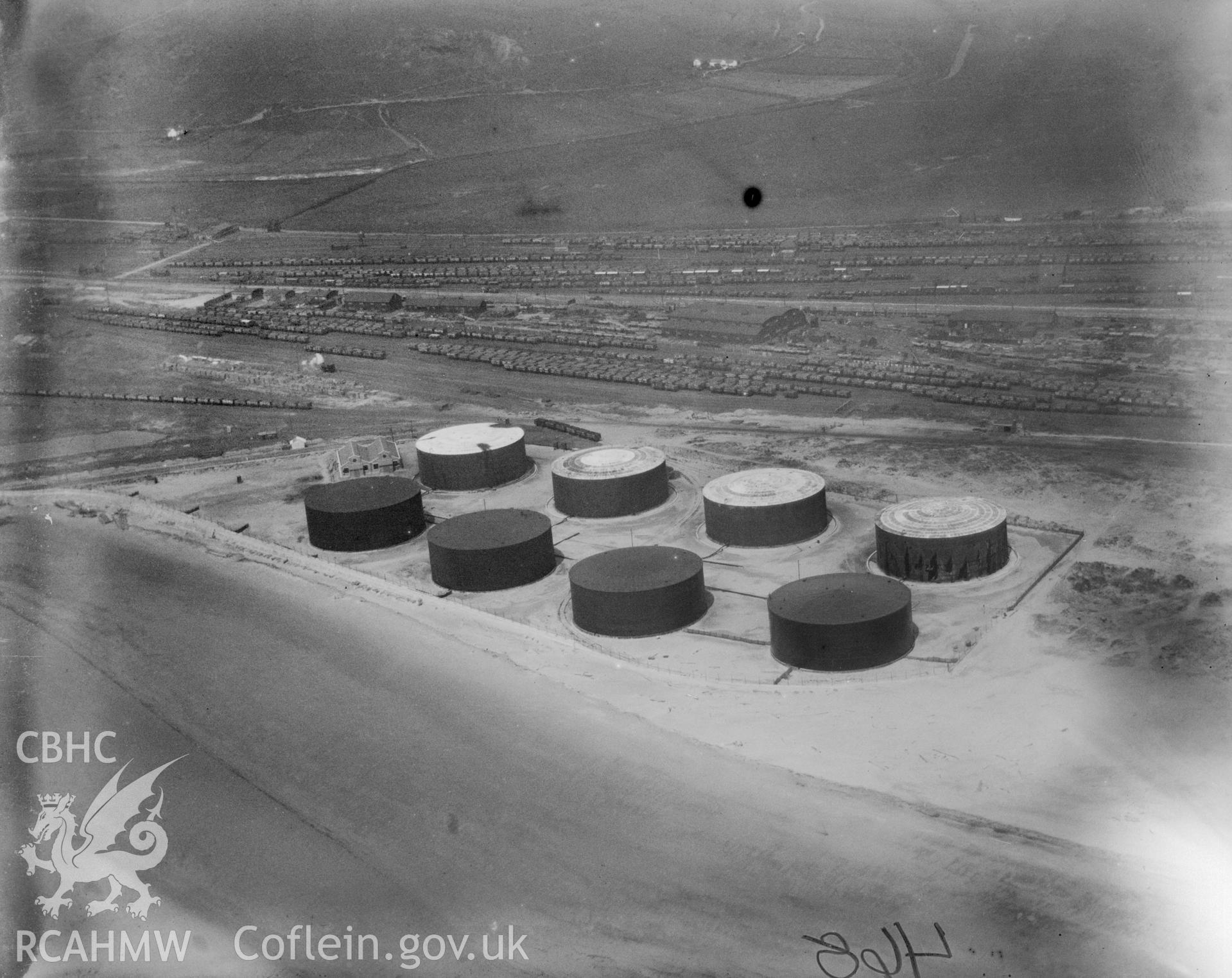 View of oil storage drums at Crumlin Burrows, Swansea. Oblique aerial photograph, 5?x4? BW glass plate.