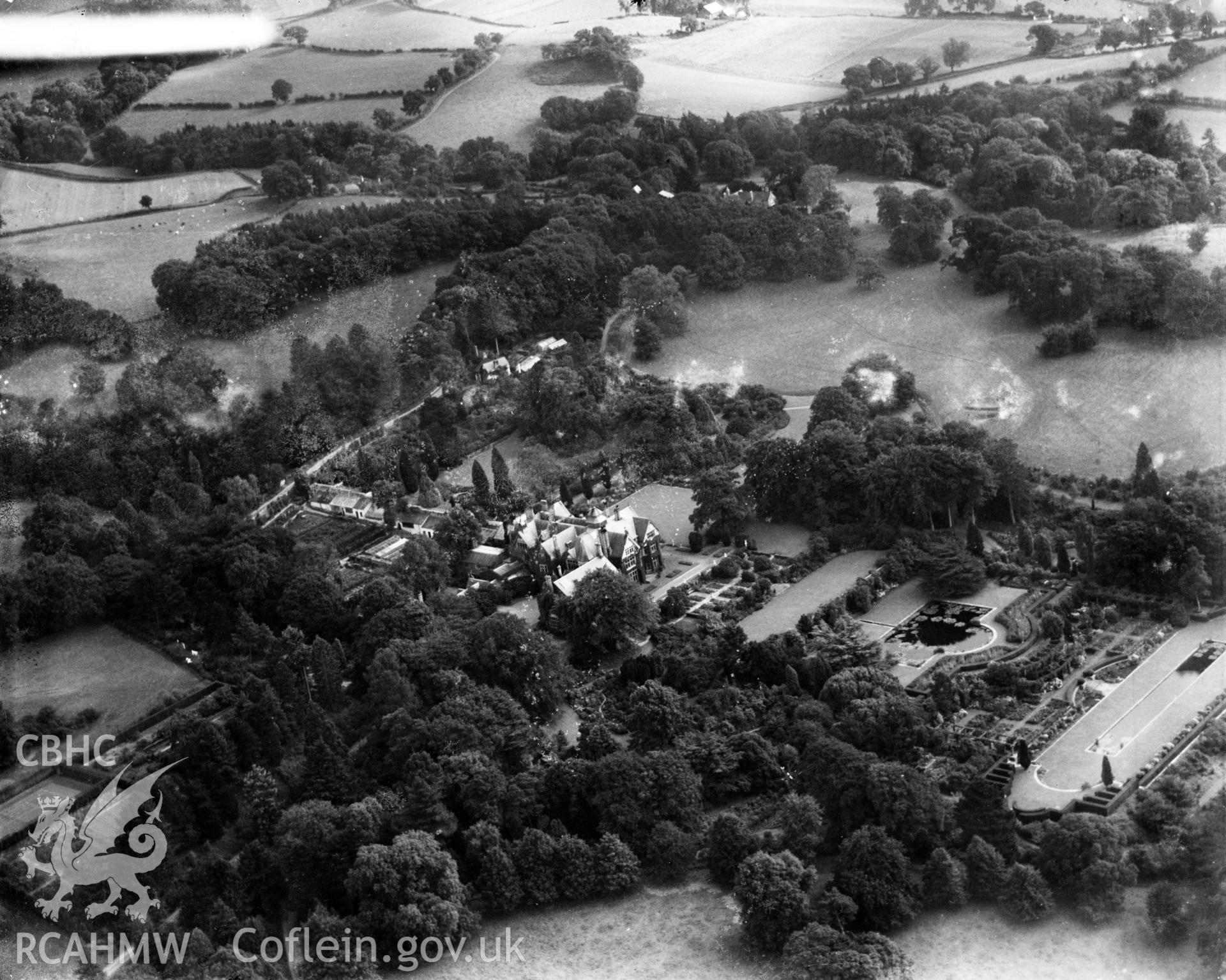 View of Bodnant House and gardens, oblique aerial view. 5?x4? black and white glass plate negative.