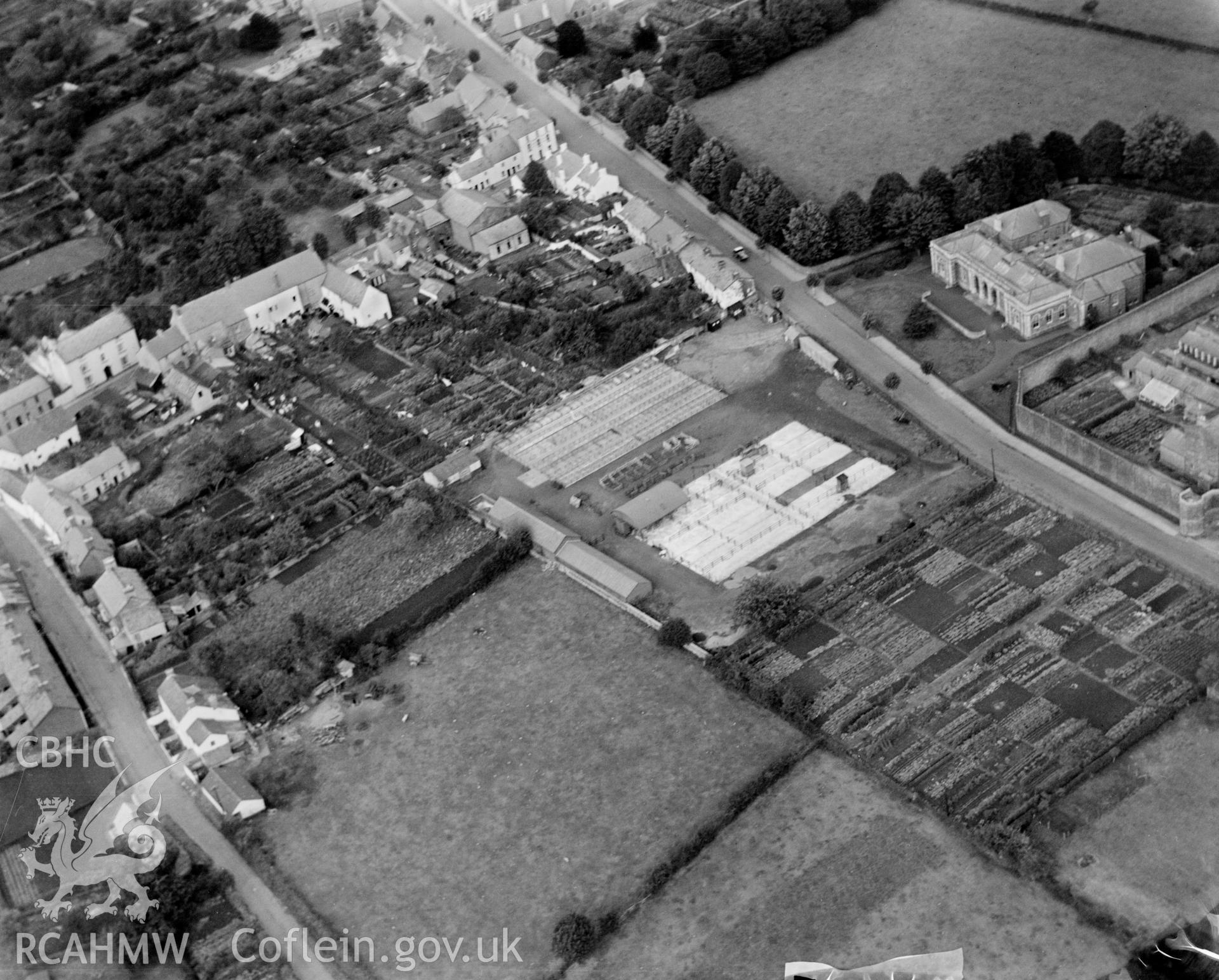 View of Usk showing the Court House, allotment gardens and cattle market. Oblique aerial photograph, 5?x4? BW glass plate.