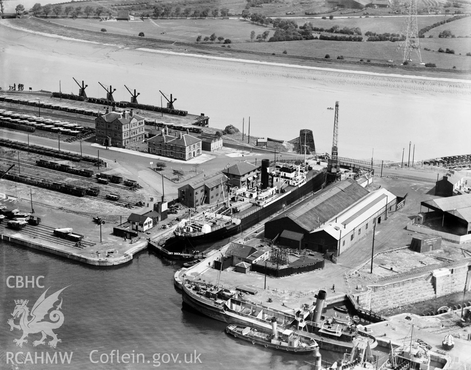 View of a ship in dry dock,  Newport, oblique aerial view. 5?x4? black and white glass plate negative.
