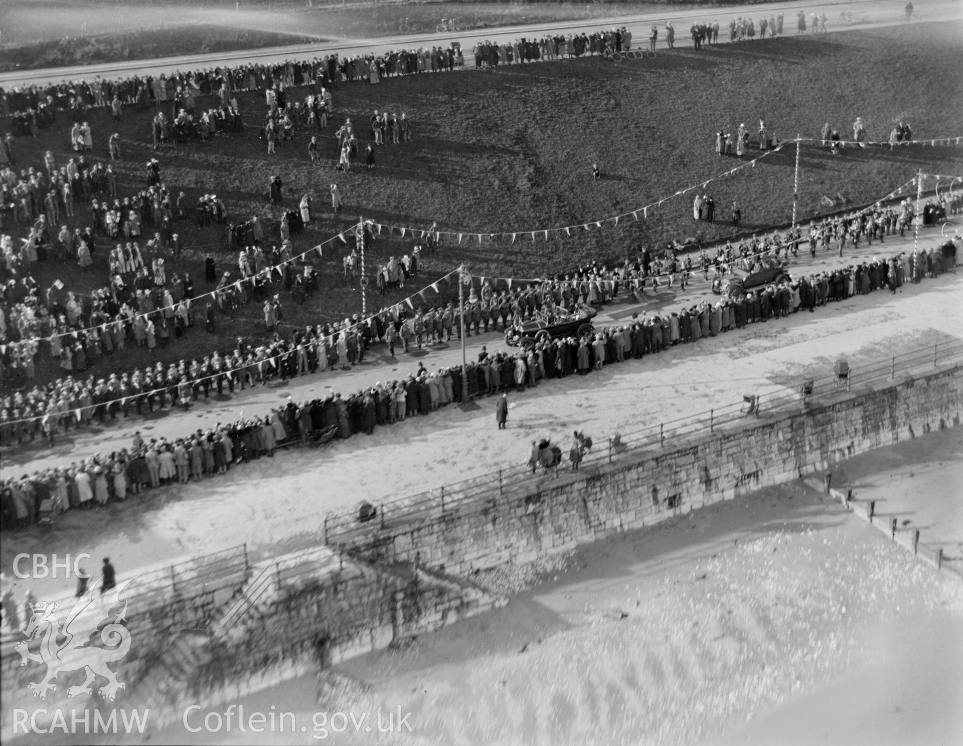 Colwyn Bay showing ceremony and crowds during during the visit of the Prince of Wales (later Edward VIII) in November 1923, oblique aerial view. 5?x4? black and white glass plate negative.