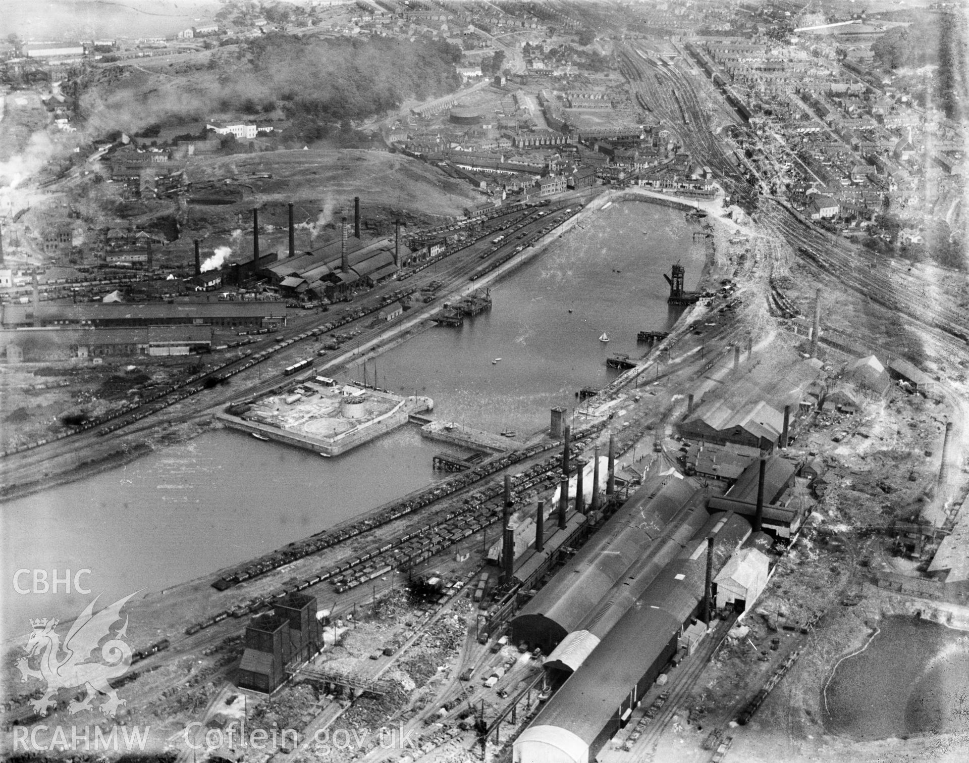 View of Briton Ferry showing the docks and steelworks, oblique aerial view. 5?x4? black and white glass plate negative.