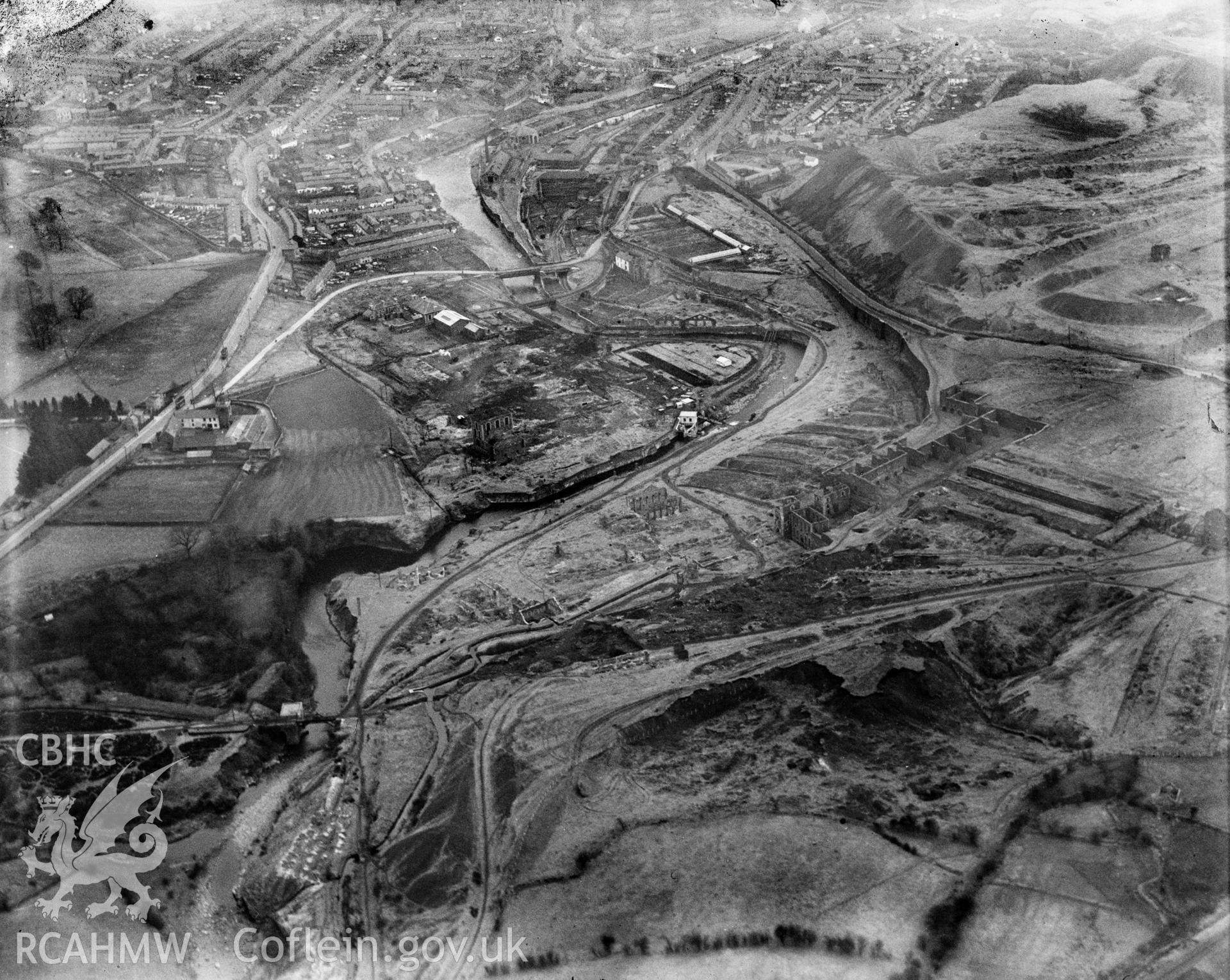 View of Williamstown, Merthyr Tydfil, showing ruined ironworks, oblique aerial view. 5?x4? black and white glass plate negative.