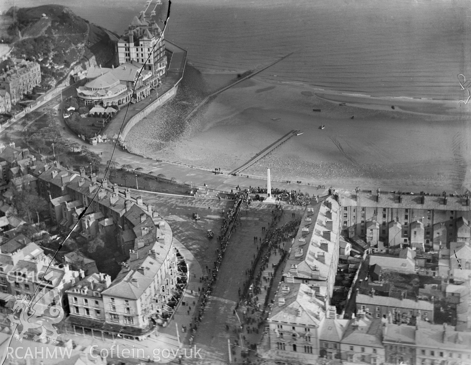 Prince Edward Square, Llandudno, showing the Cenotaph war memorial during ceremony, oblique aerial view. 5?x4? black and white glass plate negative.