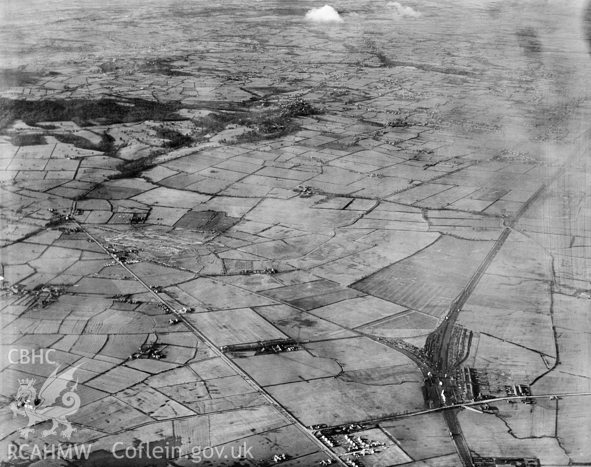 High altitude view of Vickers-Armstrong Ltd. works  - Broughton airfield under construction. Oblique aerial photograph, 5?x4? BW glass plate.