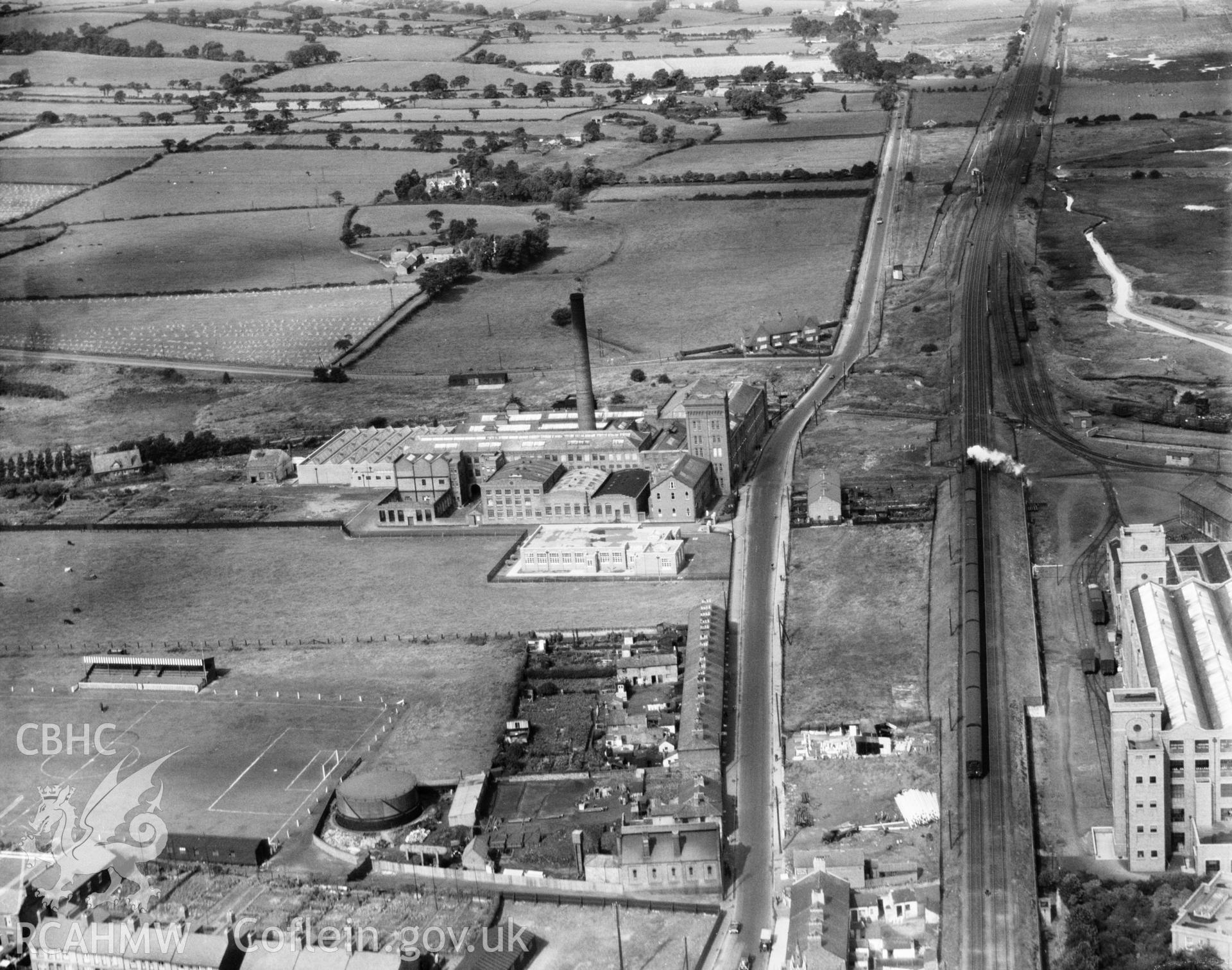 View of Deeside Mill, Courtalds Ltd., and football ground, oblique aerial view. 5?x4? black and white glass plate negative.