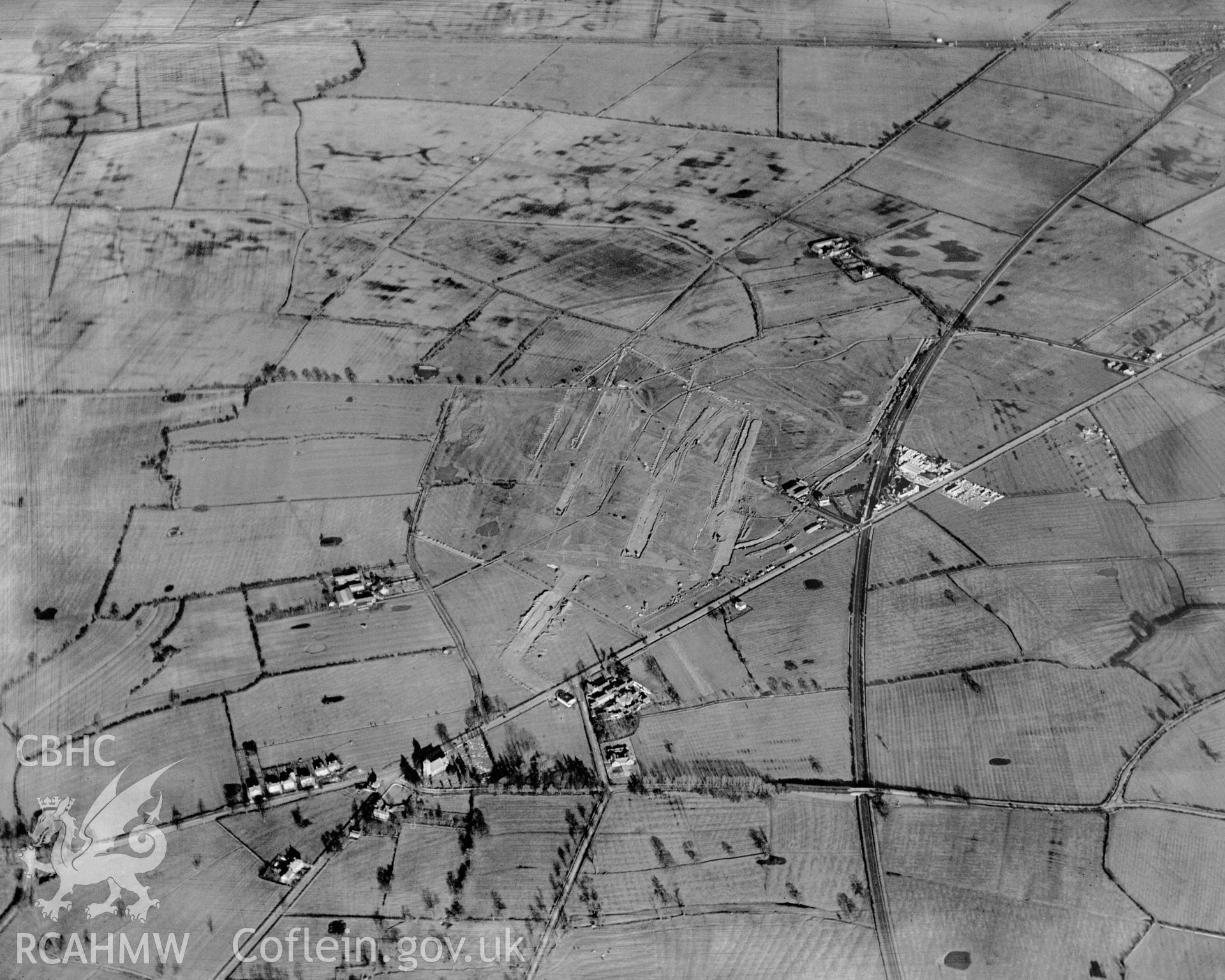View of Vickers-Armstrong Ltd. works  - Broughton airfield under construction. Oblique aerial photograph, 5?x4? BW glass plate.