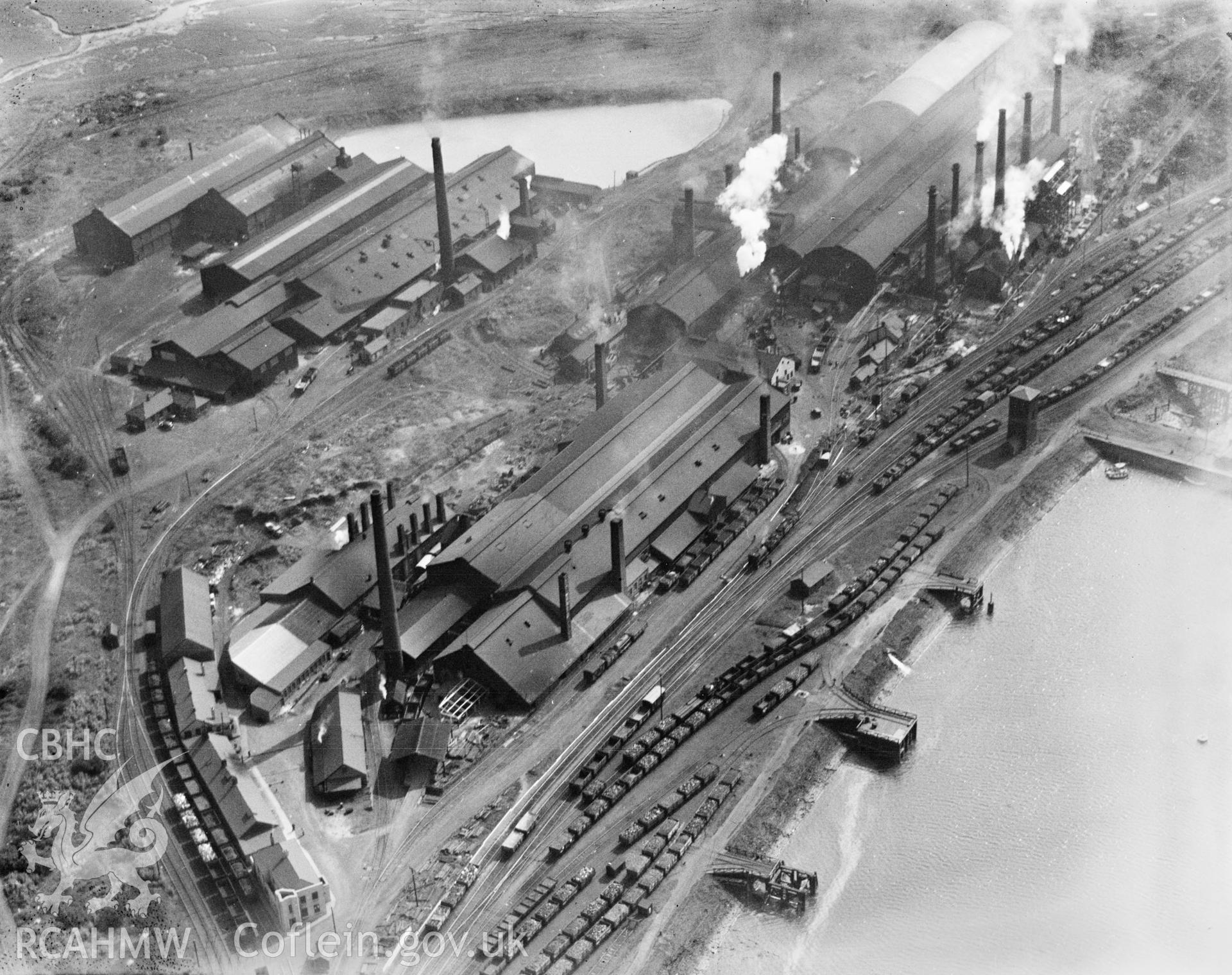 View of Baglan Bay tinplate works, Whitford and Albion works, Briton Ferry from the north, oblique aerial view. 5?x4? black and white glass plate negative.