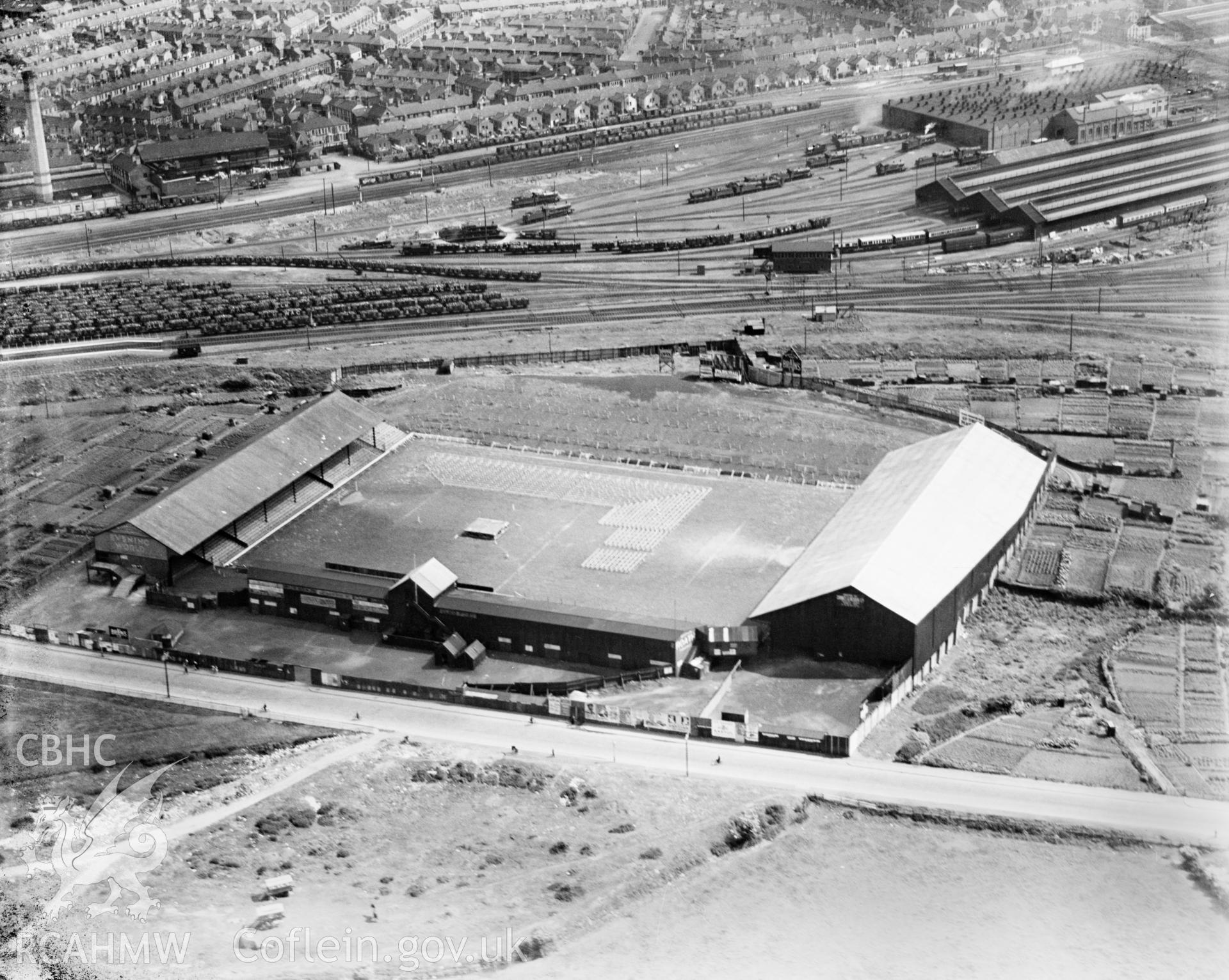 View of Ninian Park football ground showing a boxing match in 1933. Thought to be the boxing match between Jack Peterson and Hein Muller, British and German heavyweight champions, May 15th, 1933. Oblique aerial view. 5?x4? black and white glass plate negative.