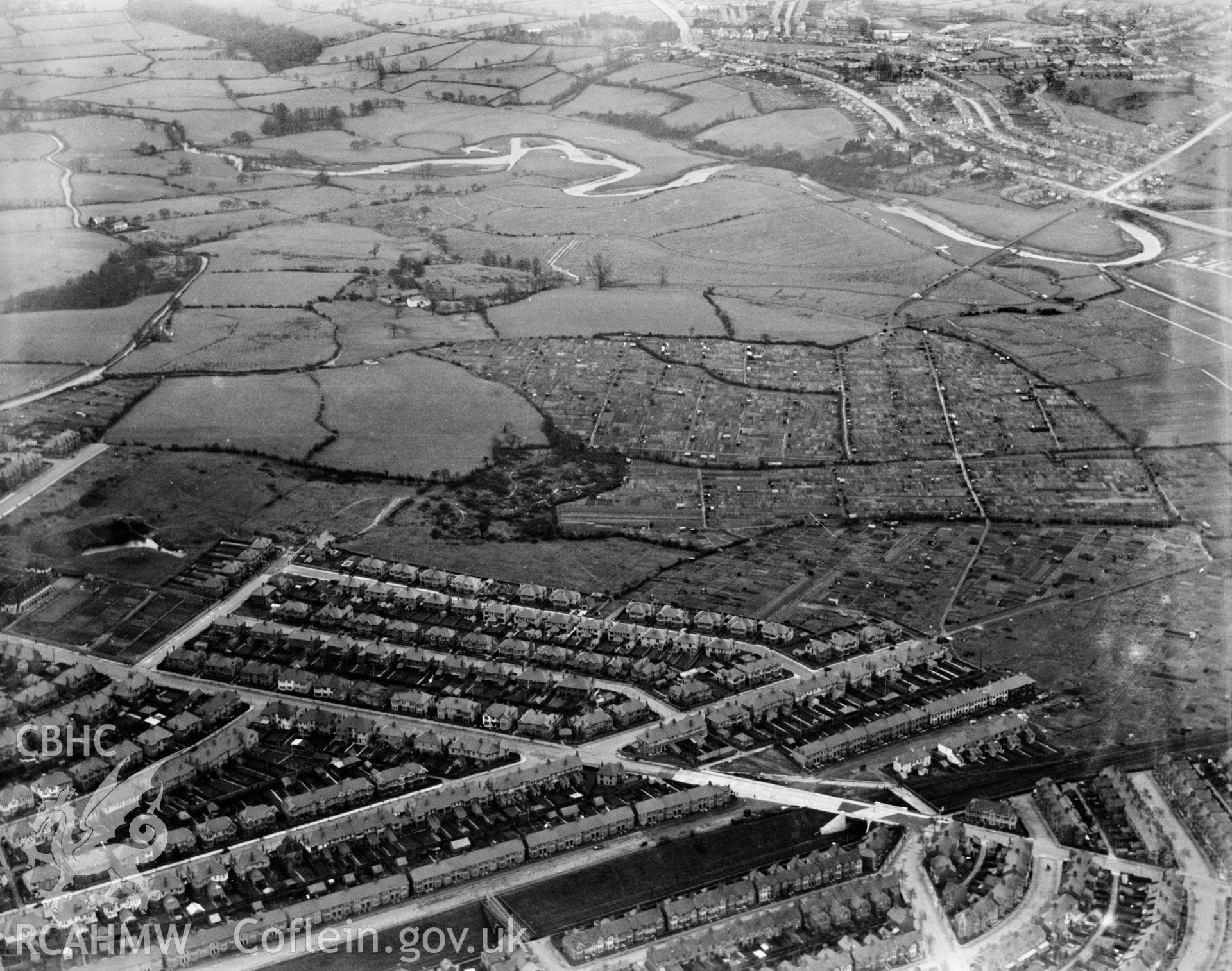 View of Cardiff showing the area near Rumney and Pengam Moor and allotment gardens, oblique aerial view. 5?x4? black and white glass plate negative.