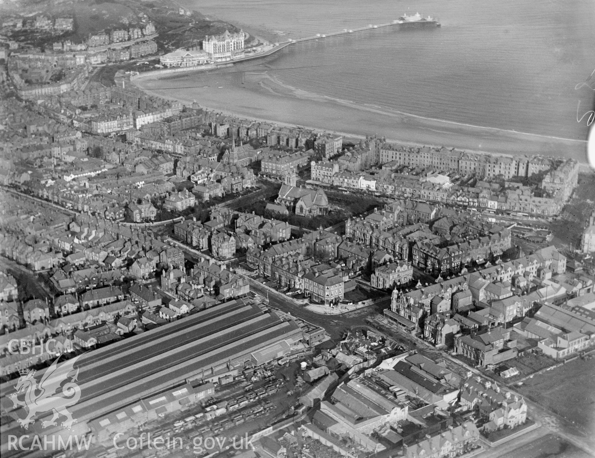 General view of Llandudno showing pier and station, oblique aerial view. 5?x4? black and white glass plate negative.