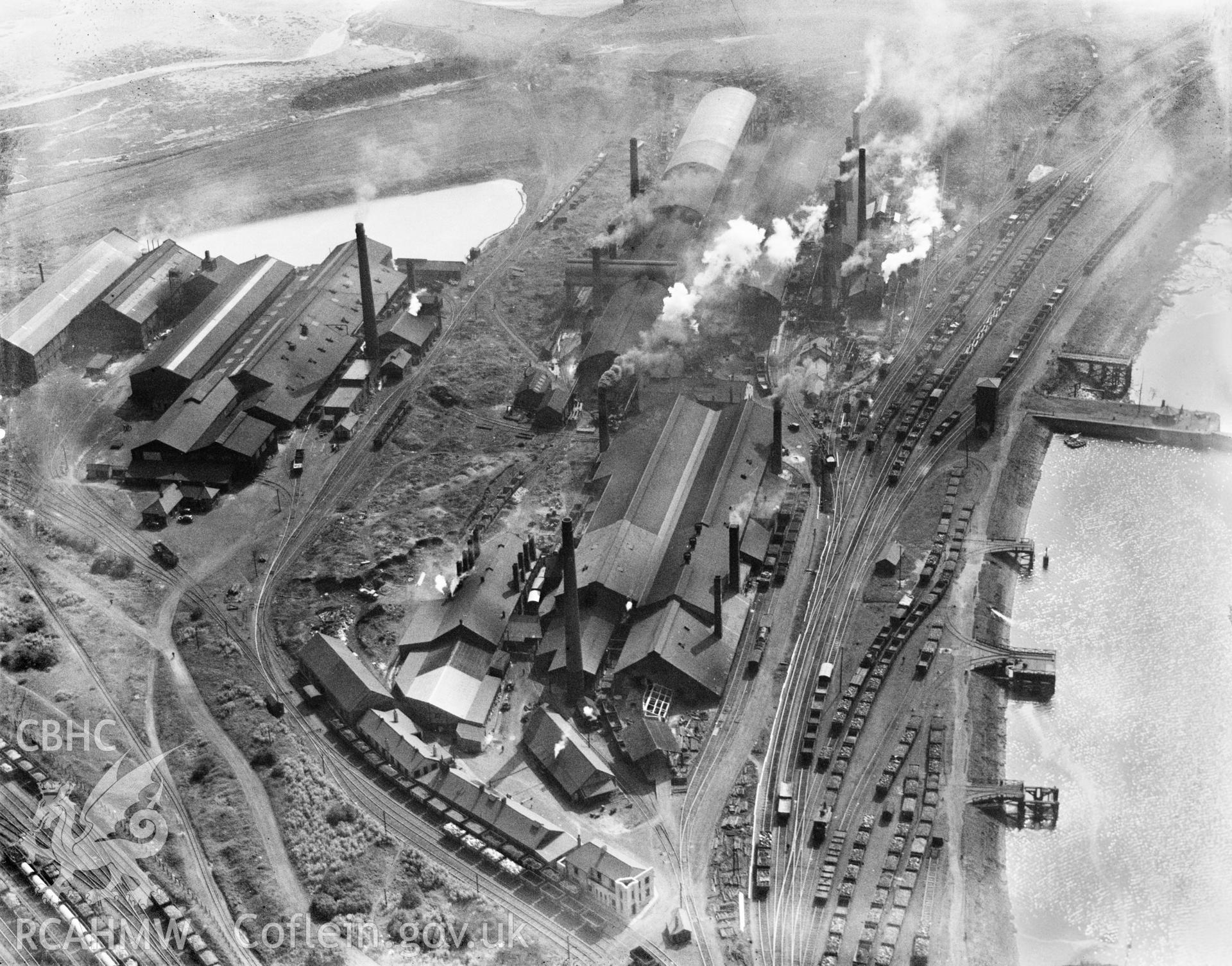 View of Baglan Bay tinplate works, Whitford and Albion works, Briton Ferry from the north, oblique aerial view. 5?x4? black and white glass plate negative.