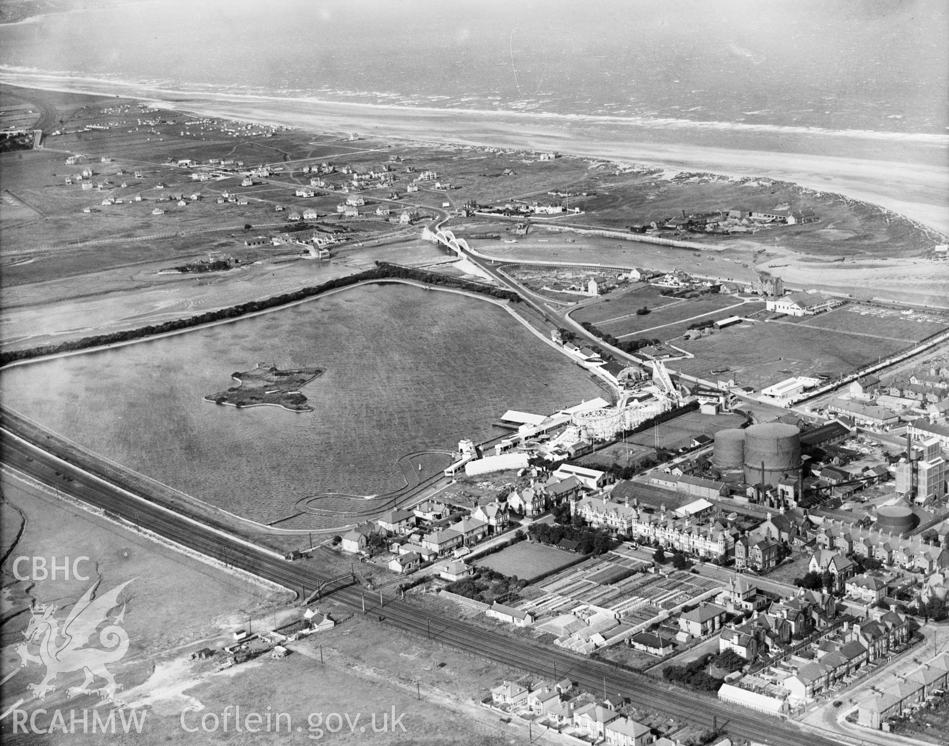 View of Rhyl showing the Marine Lake and funfair, oblique aerial view. 5?x4? black and white glass plate negative.