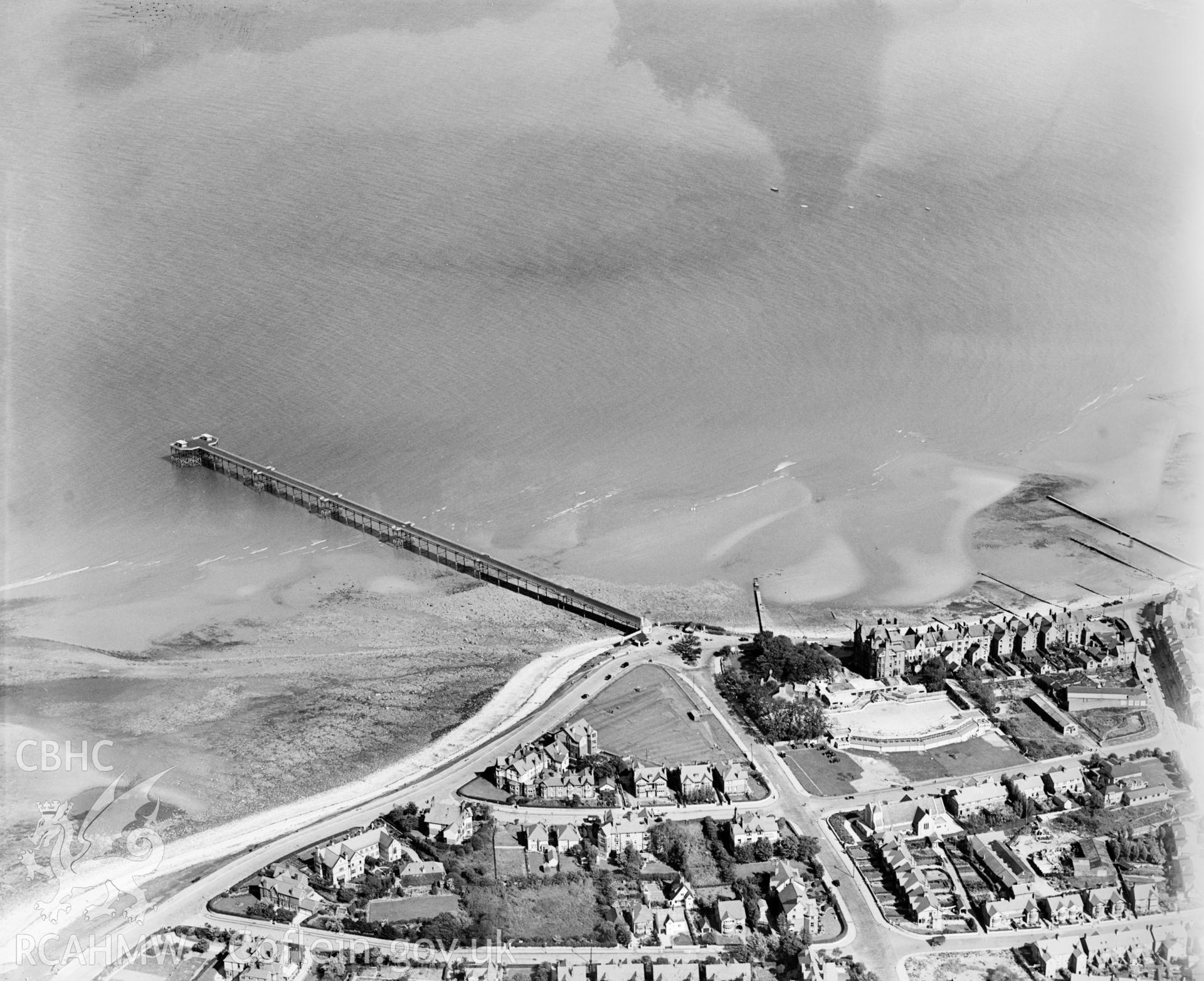 View of Rhos-on-Sea showing swimming pool, pier, housing and pumping station, oblique aerial view. 5?x4? black and white glass plate negative.