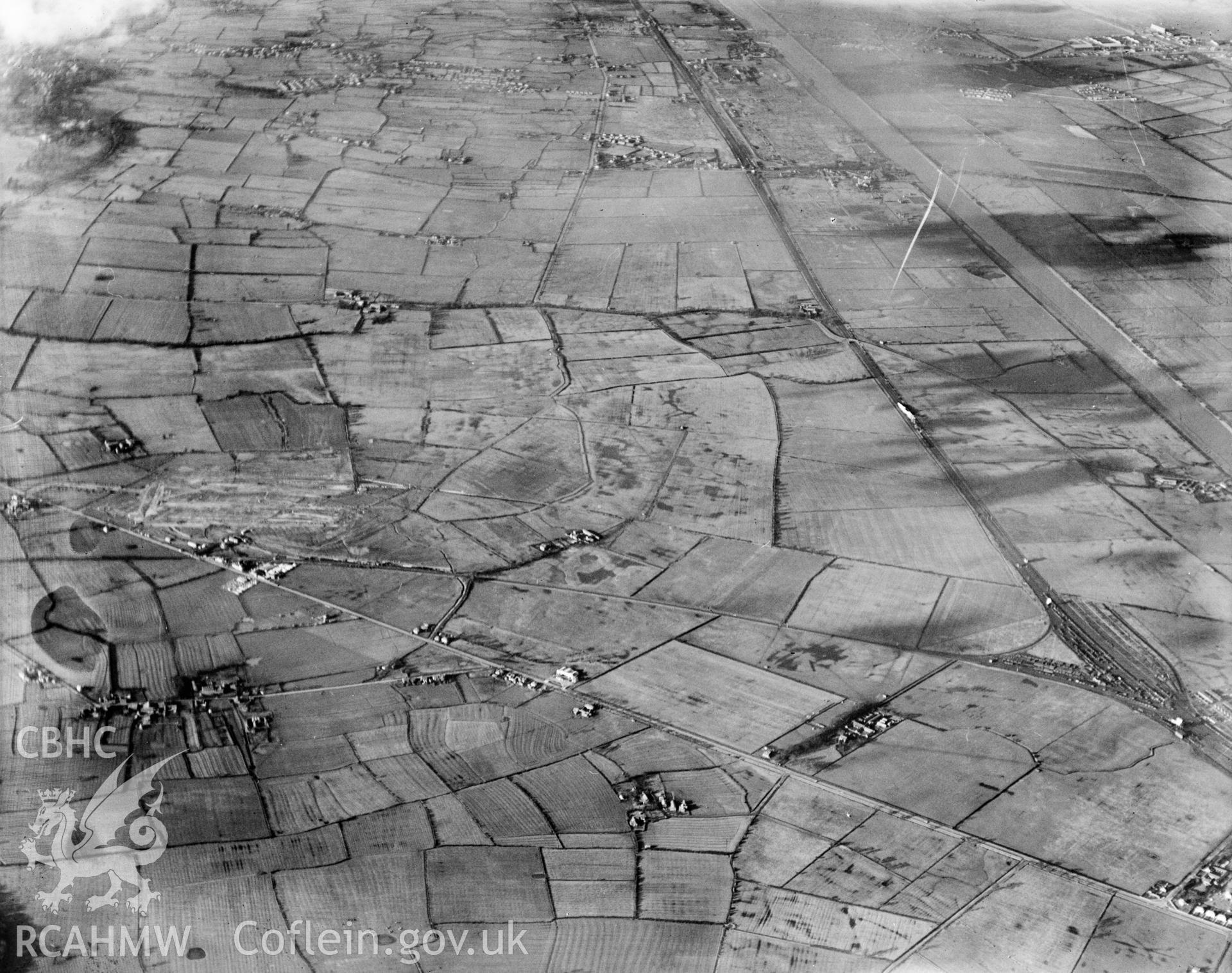 View of Vickers-Armstrong Ltd. works  - Broughton airfield under construction. Oblique aerial photograph, 5?x4? BW glass plate.