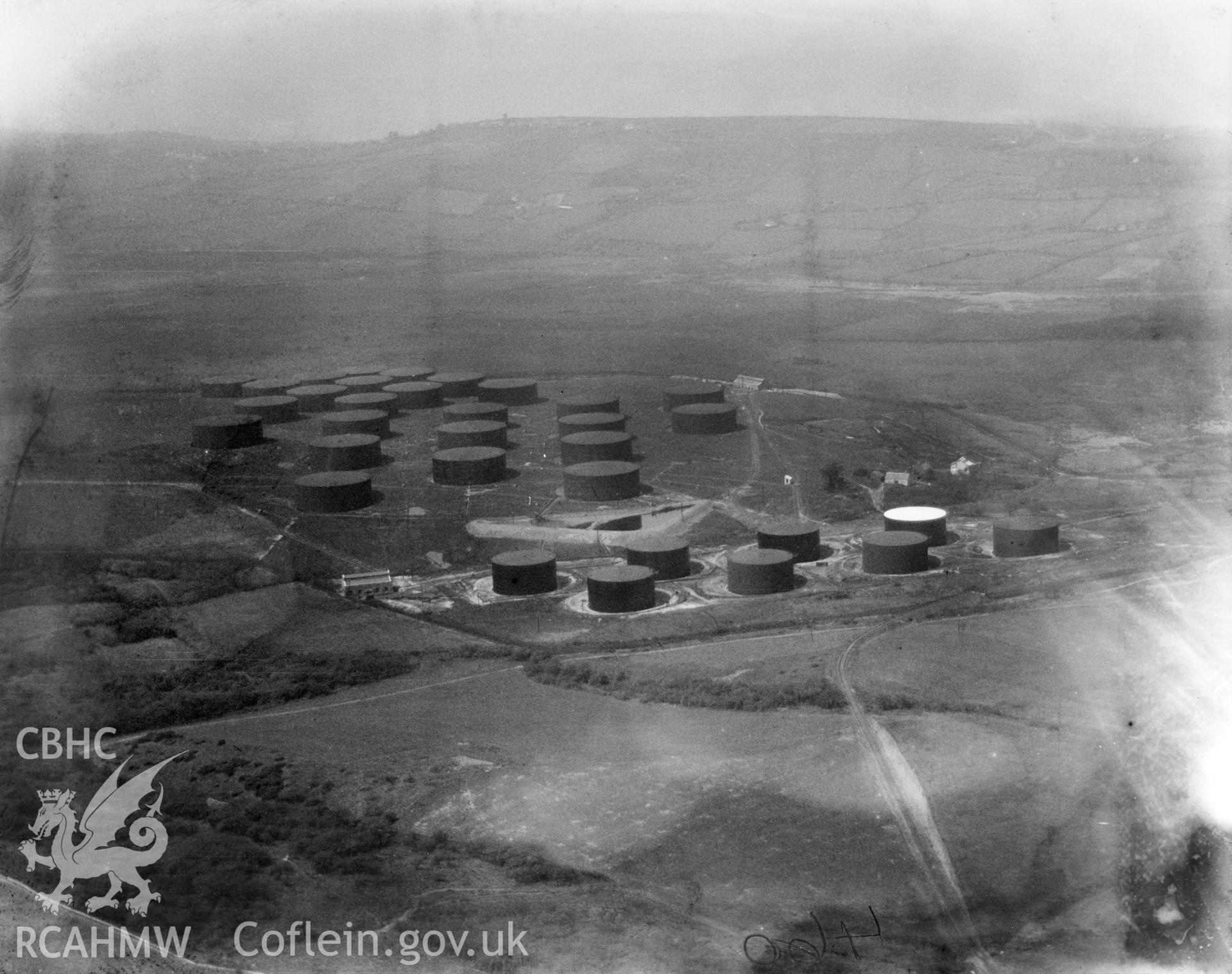 View of oil drums at the Anglo Iranian oil refinery, Llandarcy. Oblique aerial photograph, 5?x4? BW glass plate.