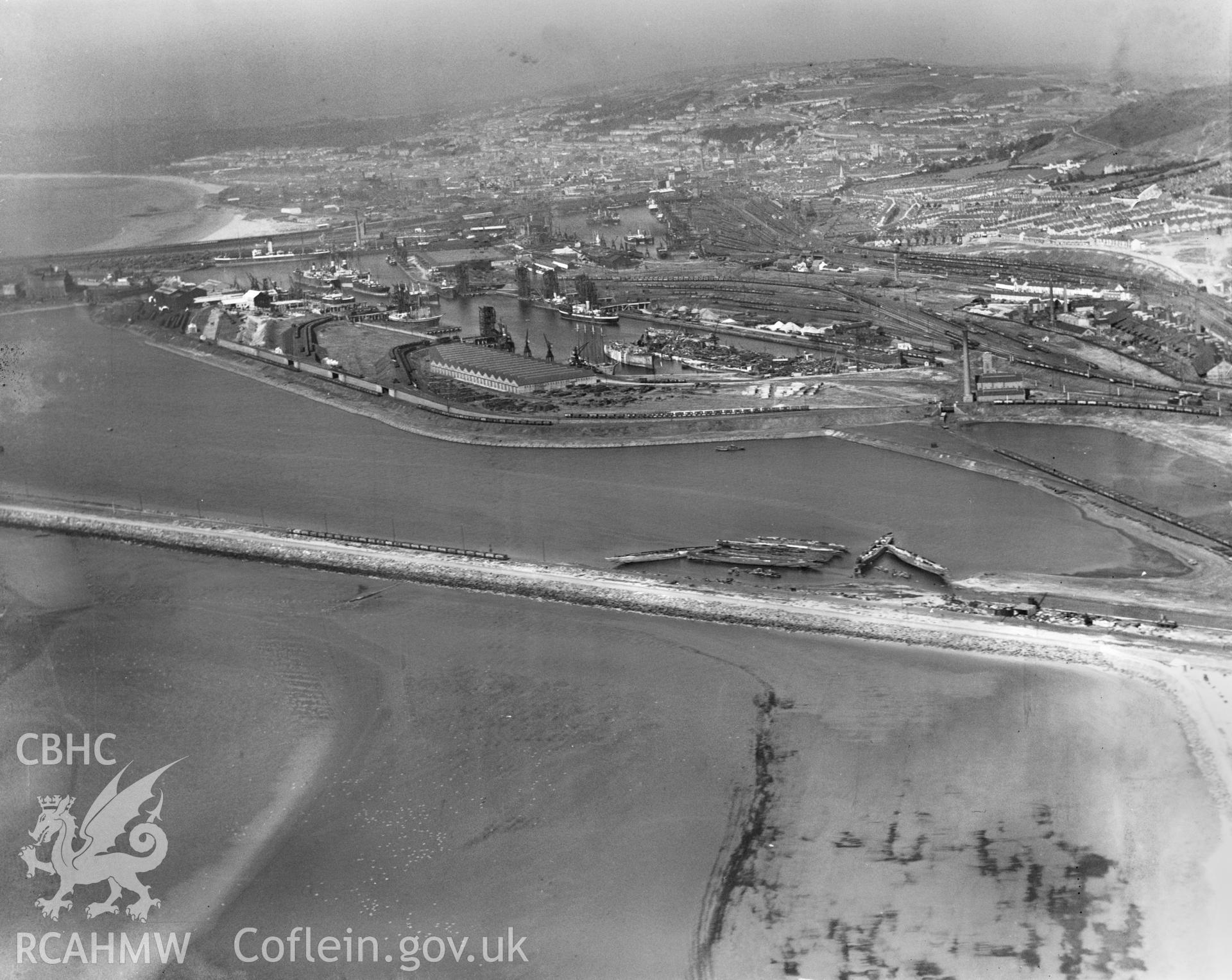 View of Swansea docks showing T. W. Ward's new scrapping berth at the eastern end of Kings Dock, oblique aerial view. 5?x4? black and white glass plate negative.