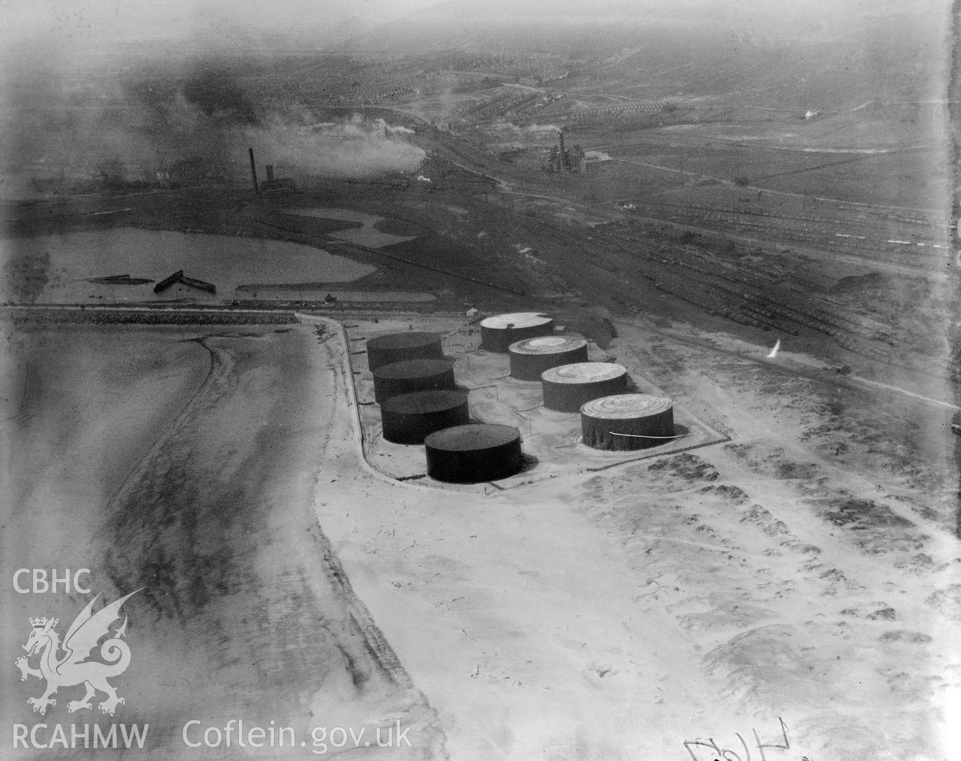 View of oil storage drums at Crumlin Burrows, Swansea. Oblique aerial photograph, 5?x4? BW glass plate.