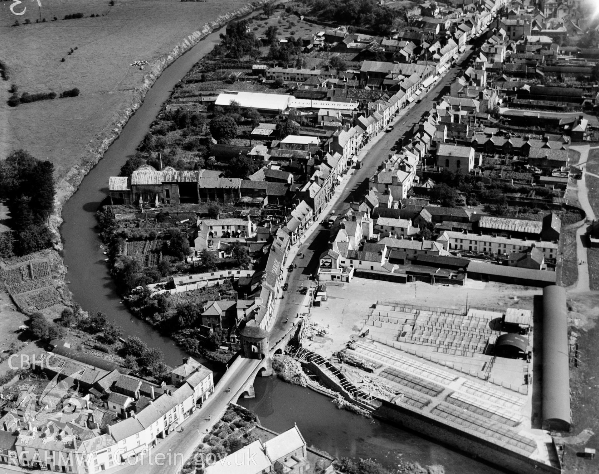 View of Monmouth showing Monnow bridge and cattle market. Oblique aerial photograph, 5?x4? BW glass plate.