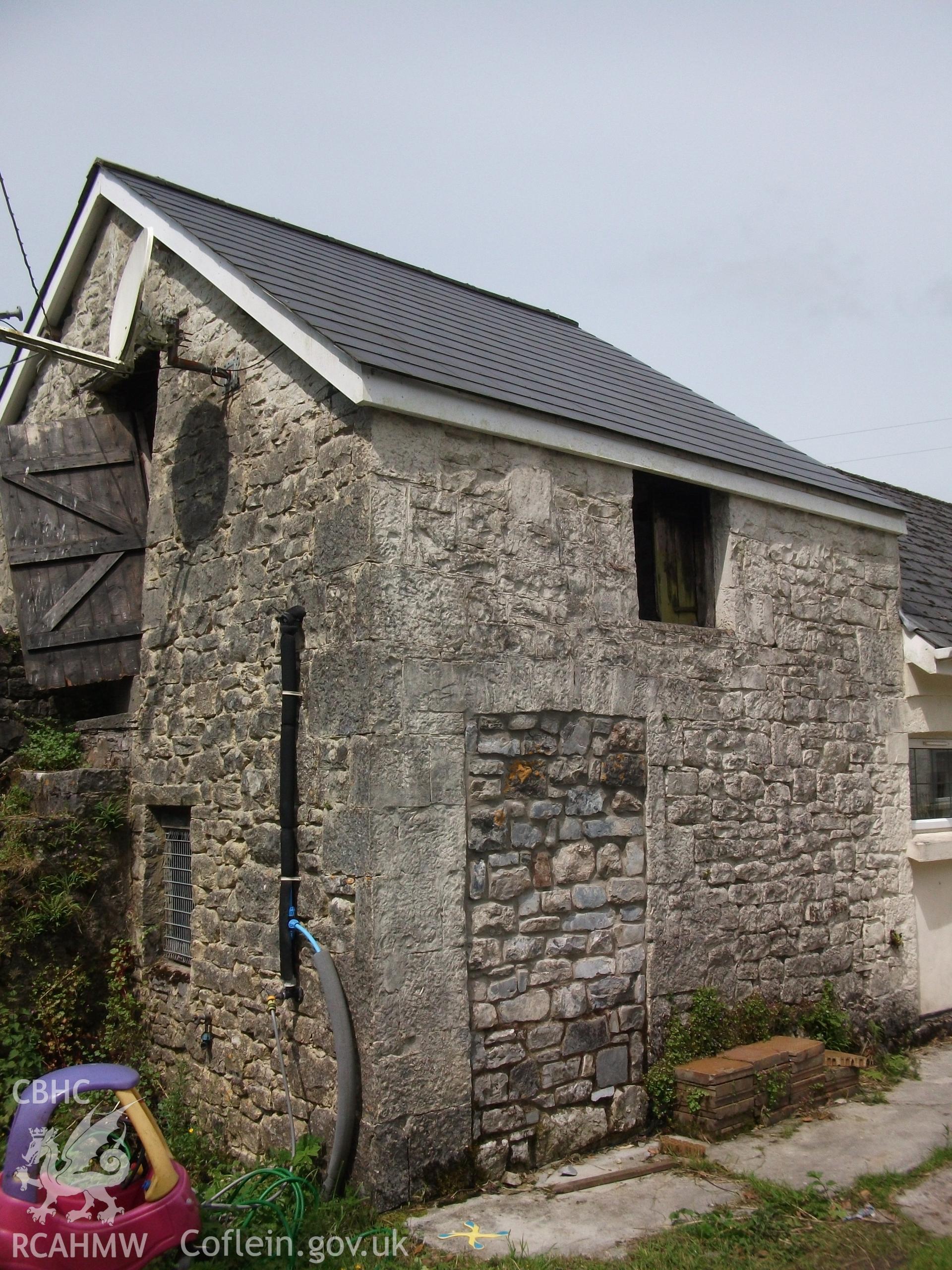 Photograph showing exterior rear elevation of the building attached to the cottage at Pant-y-Castell, Maesybont, Photographed by Mark Waghorn to meet a condition attached to planning application.
