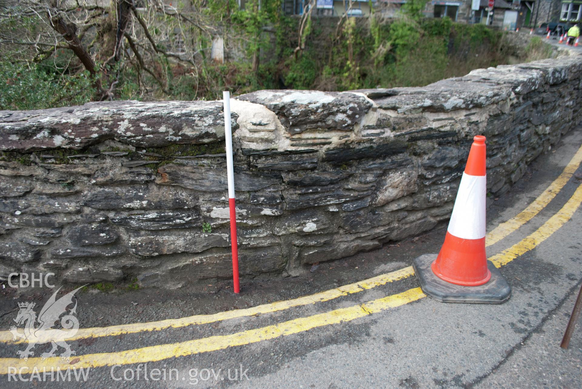 View from east south east of bridge repairs on northeast corner of the parapet, showing damage had been extensive. Digital photograph taken for Archaeological Watching Brief at Pont y Pair, Betws y Coed, 2019. Gwynedd Archaeological Trust Project G2587.