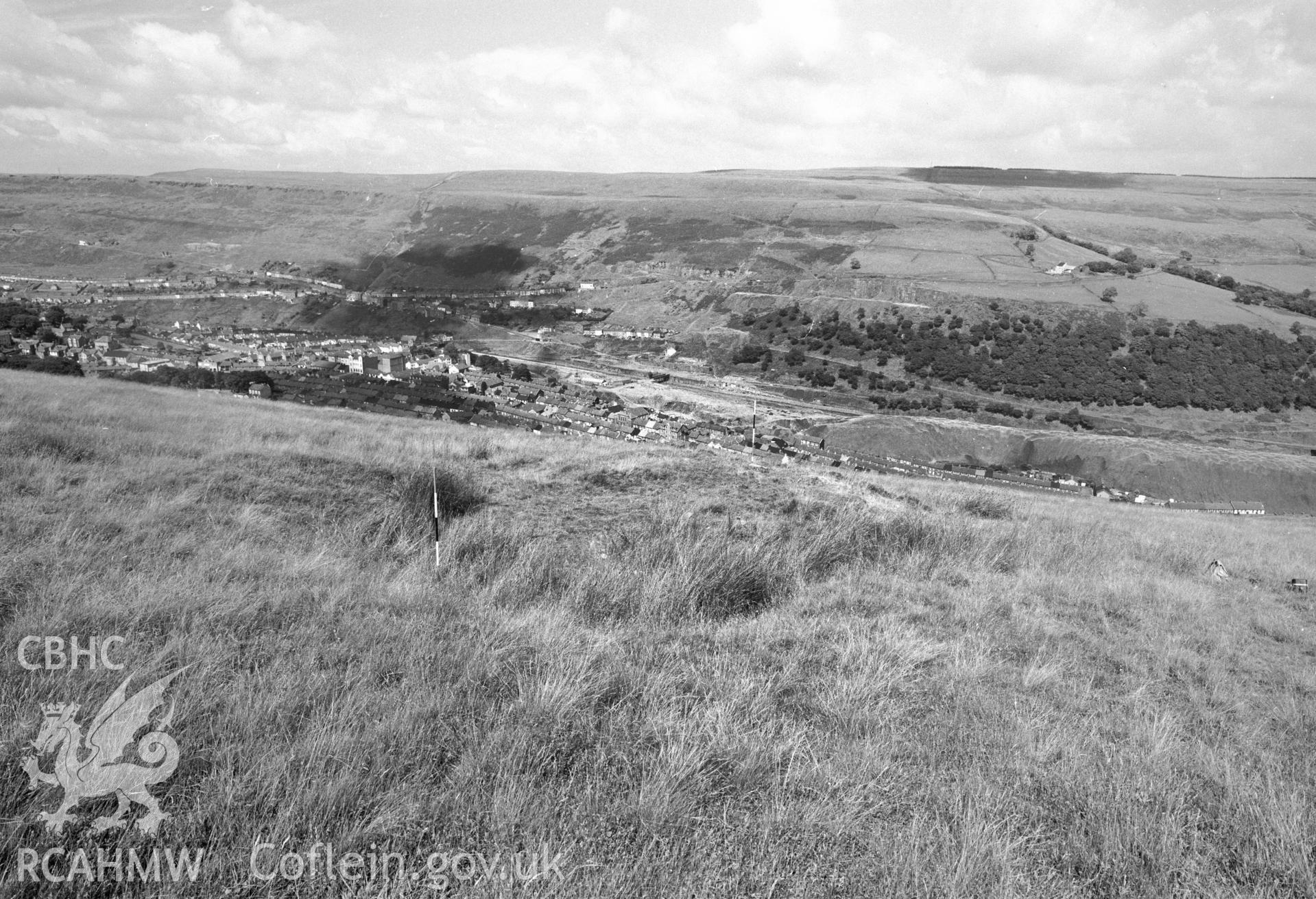 Digital copy of a black and white negative showing view of platform house, medieval earthworks in Ferndale.