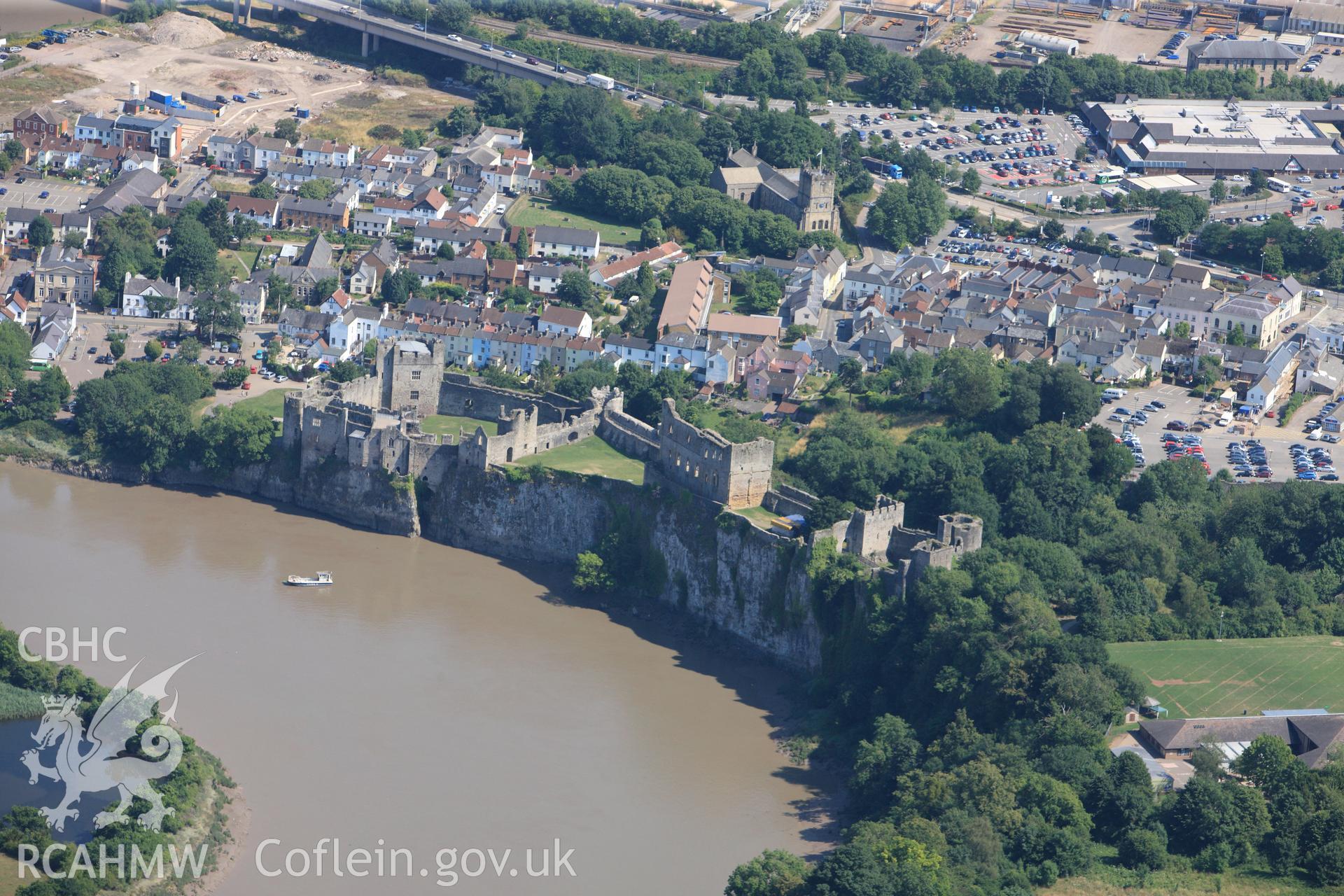 Chepstow Castle and St. Mary's church, Chepstow. Oblique aerial photograph taken during the Royal Commission?s programme of archaeological aerial reconnaissance by Toby Driver on 1st August 2013.