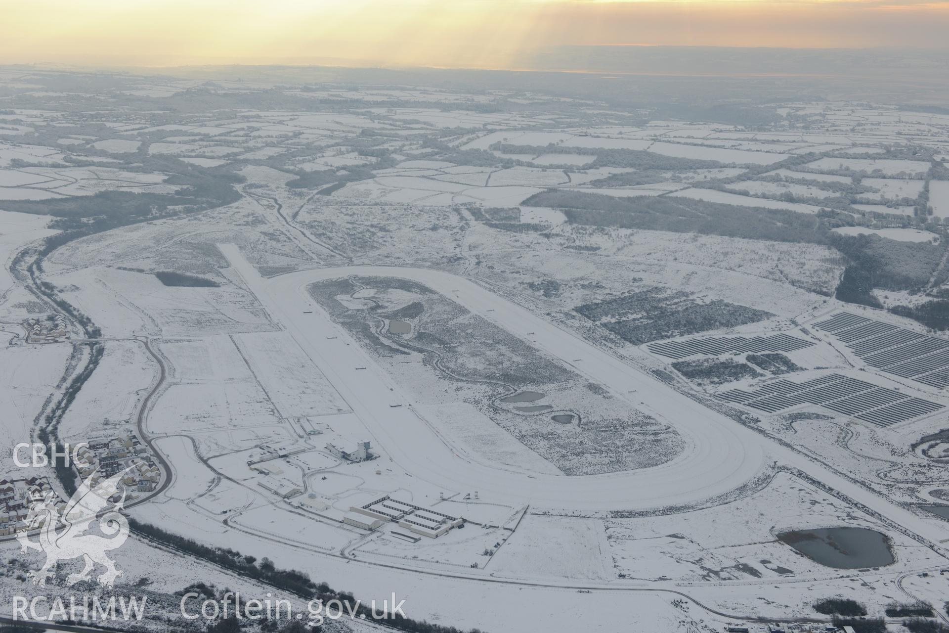Ffos Las racecourse and Ffos Las solar farm, Trimsaran, north west of Llanelli. Oblique aerial photograph taken during the Royal Commission?s programme of archaeological aerial reconnaissance by Toby Driver on 24th January 2013.