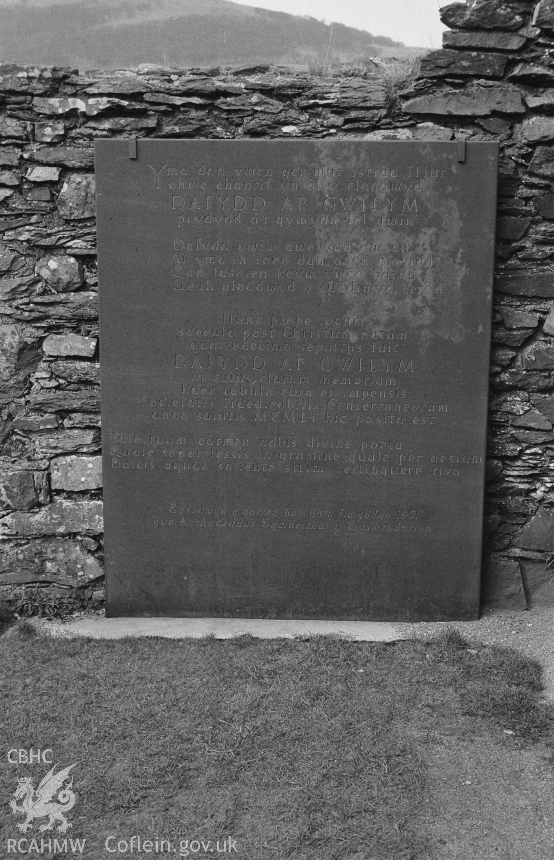 Digital copy of black & white negative showing memorial stone for Dafydd ap Gwilym fixed to inside of north wall of north transept of Strata Florida Abbey, Pontrhydfendigaid. Photographed in April 1964 by Arthur O. Chater from Grid Reference SN 7468 6574.