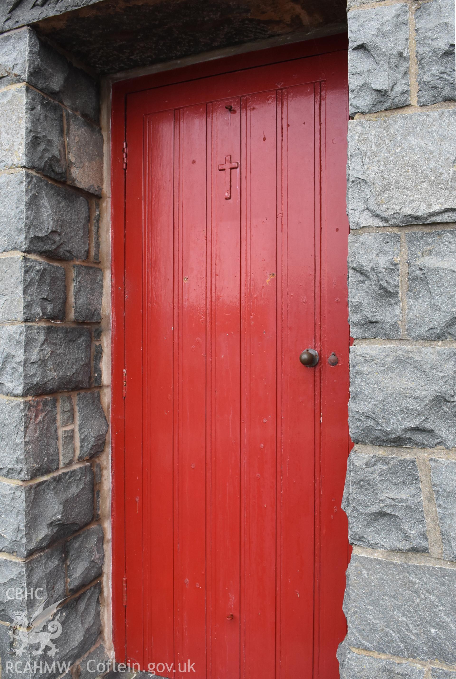 Detailed view of external door at side elevation of the Catholic Church of the Holy Spirit, Criccieth. Photographed during survey conducted by Sue Fielding for the RCAHMW, 21st January 2019.