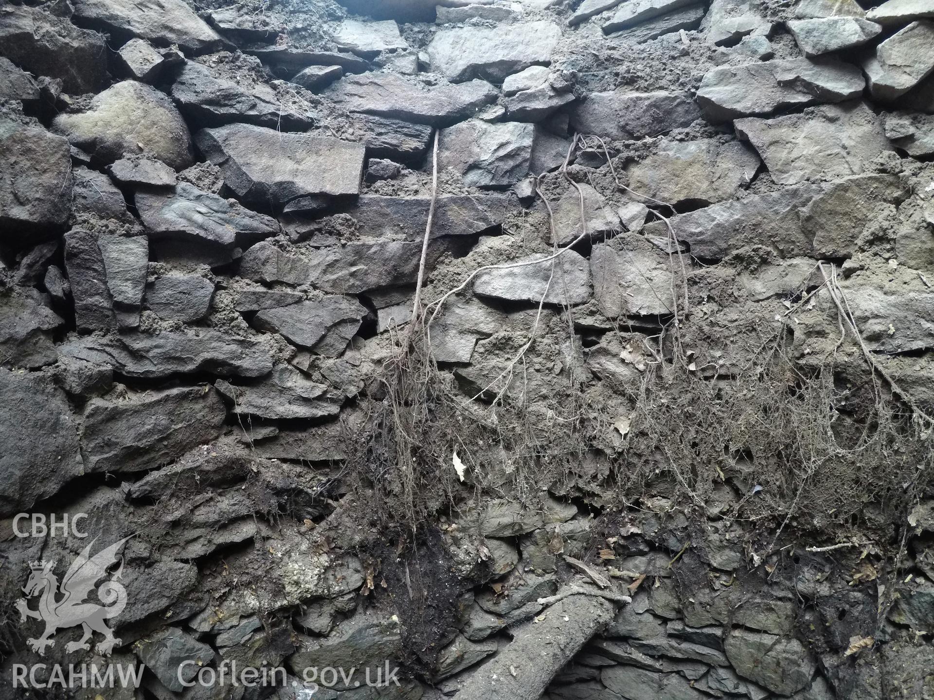 View from the south of well interior at 1.0m depth. Photographed by Gwynedd Archaeological Trust as part of archaeological mitigation report for well at Plas Celynin, Henryd, Conwy, on 1st August 2018. Project no. G2568.