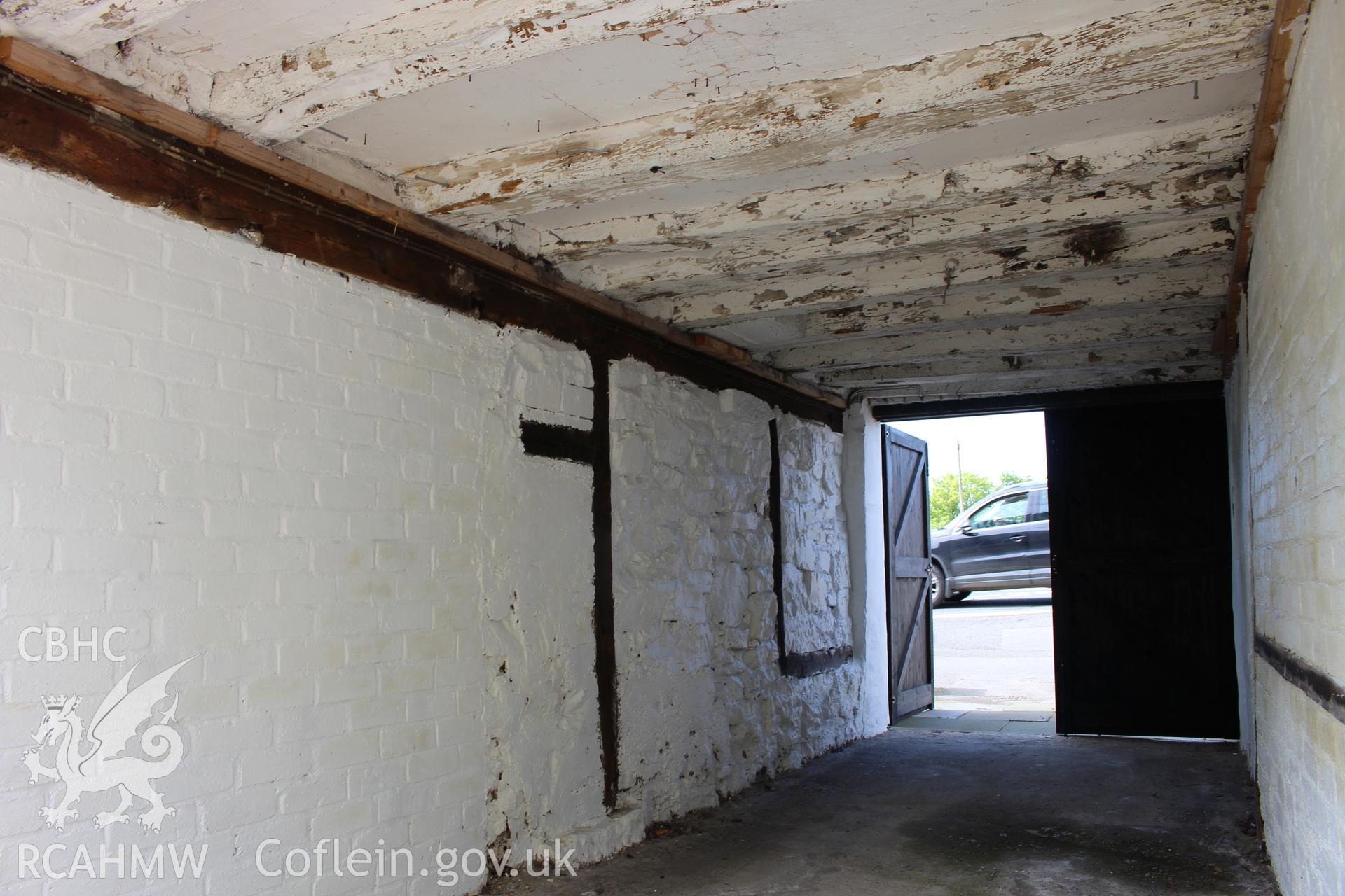 Colour photograph showing interior view of external covered vehicular opening on left of No 5 Mwrog Street, Ruthin. Photographed during survey conducted by Geoff Ward on 14th May 2014.