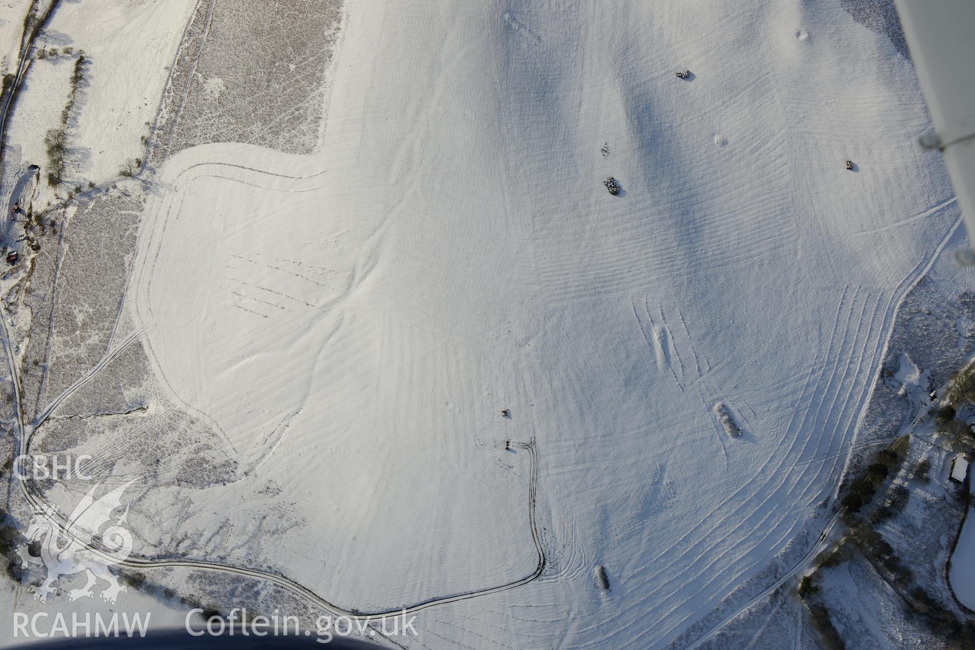 Coed Swydd pillow mounds, north east of Llandrindod Wells. Oblique aerial photograph taken during the Royal Commission?s programme of archaeological aerial reconnaissance by Toby Driver on 15th January 2013.