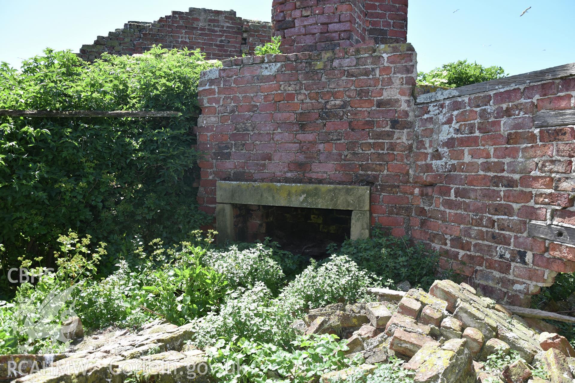 Investigator's photographic survey of the Telegraph Station on Puffin Island or Ynys Seiriol for the CHERISH Project. Interior view of ruin. ? Crown: CHERISH PROJECT 2018. Produced with EU funds through the Ireland Wales Co-operation Programme 2014-2020. All material made freely available through the Open Government Licence.