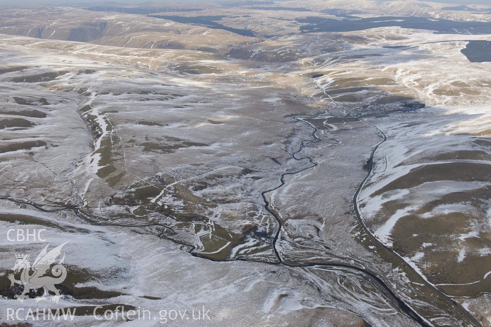 Abergwngu farmstead with associated field system and trackway, south west of Llangurig. Oblique aerial photograph taken during the Royal Commission's programme of archaeological aerial reconnaissance by Toby Driver on 2nd April 2013.