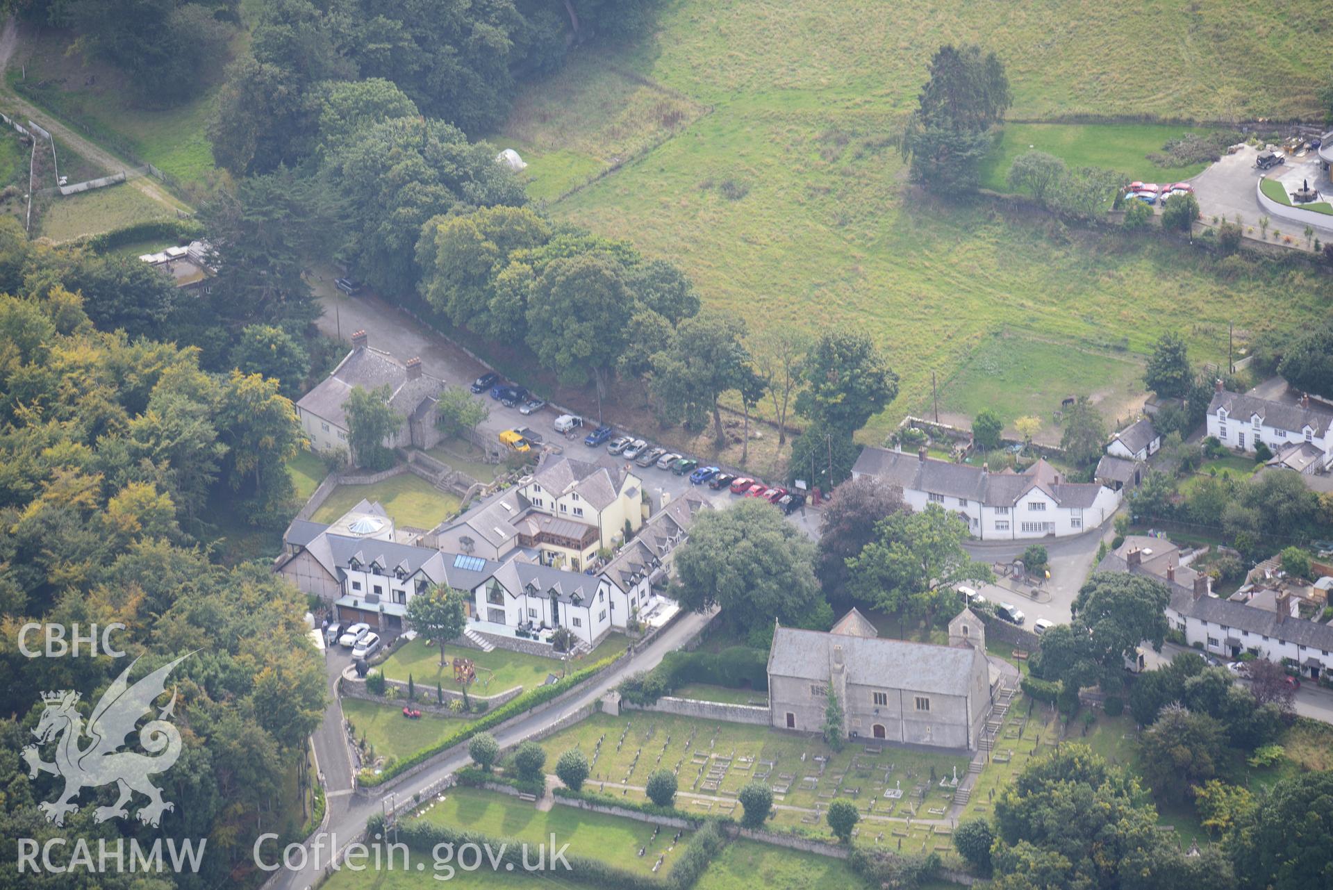 St. George's church and the Kinmel Arms, St. George, Abergele. Oblique aerial photograph taken during the Royal Commission's programme of archaeological aerial reconnaissance by Toby Driver on 11th September 2015.
