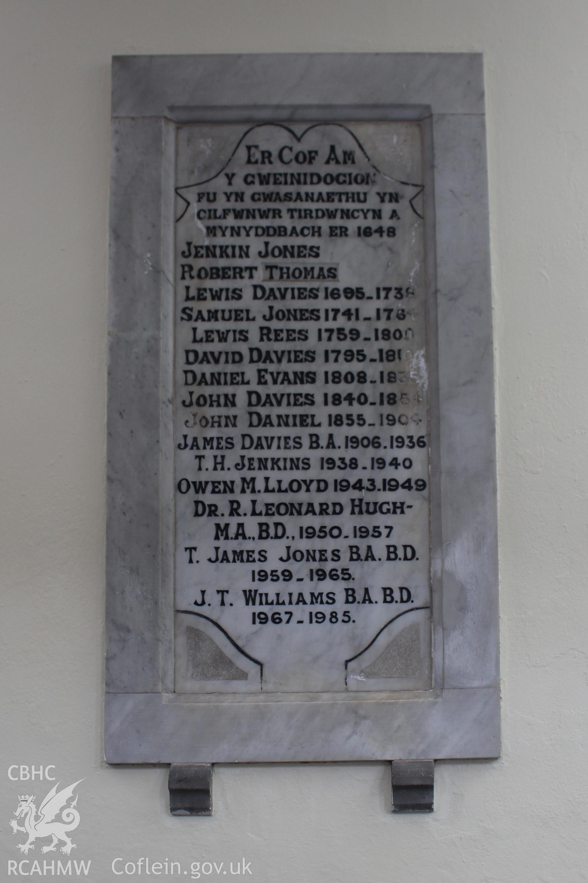 Colour photograph showing detail of memorial stone dedicated to former ministers dating from 1648 to 1985 of Mynydd Bach Independent Chapel. Taken during photographic survey conducted by Sue Fielding on 13th May 2017.