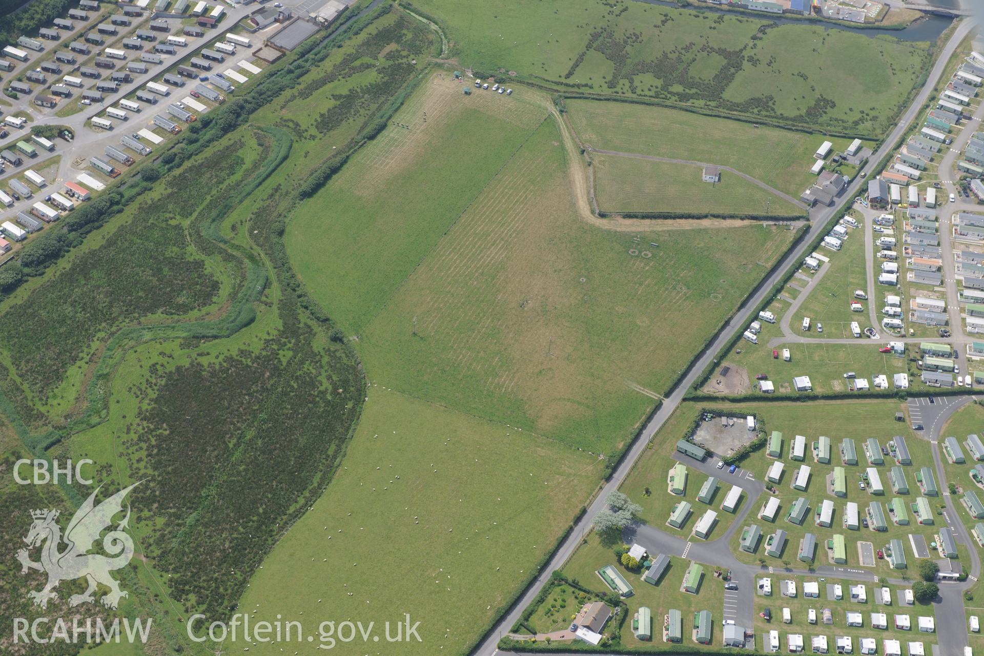 Glan-y-Mor enclosure, Clarach, north of Aberystwyth. Oblique aerial photograph taken during the Royal Commission?s programme of archaeological aerial reconnaissance by Toby Driver on 12th July 2013.