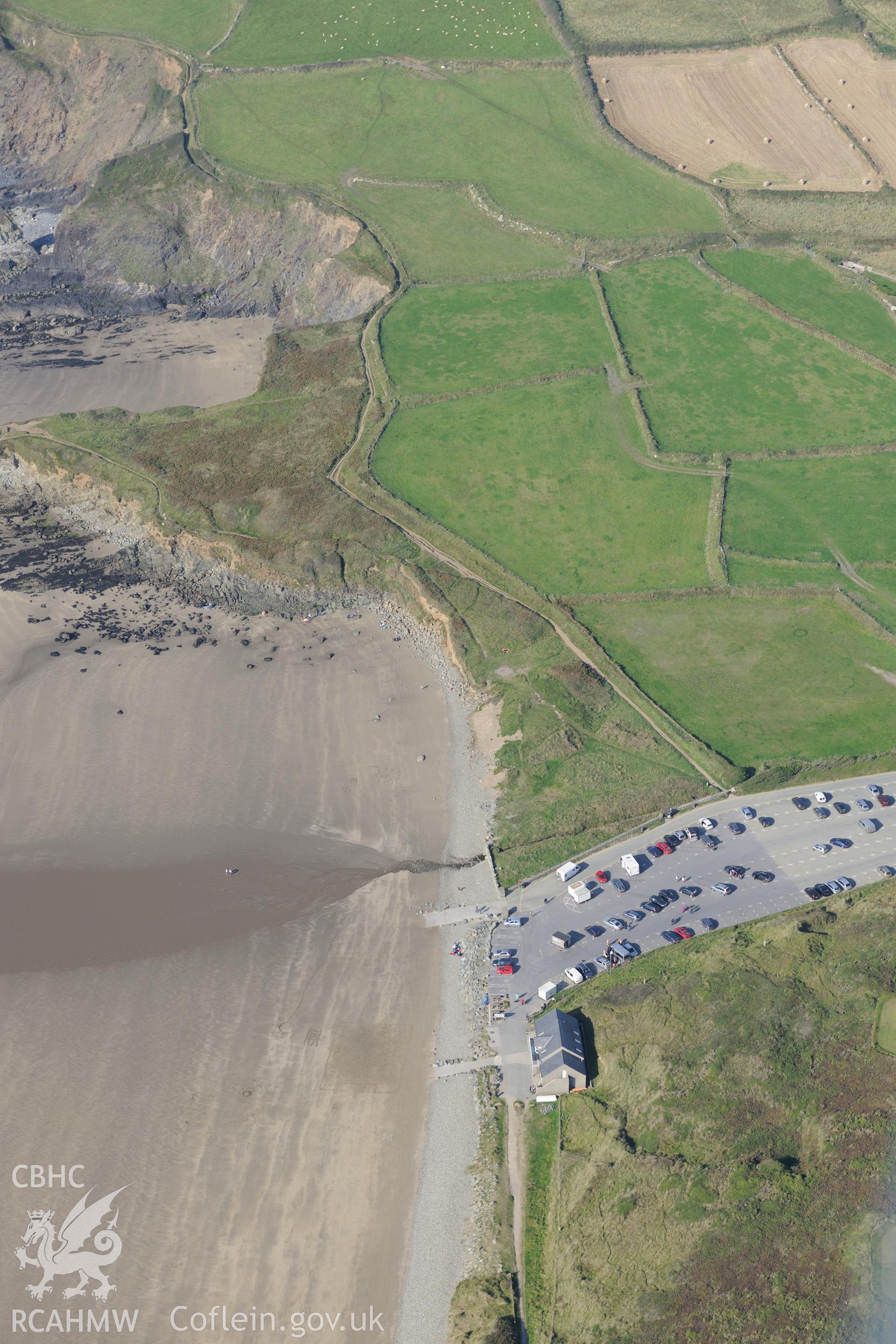 St. Patrick's chapel and Whitesands Bay landing point, north west of St David's, Pembrokeshire. Oblique aerial photograph taken during the Royal Commission's programme of archaeological aerial reconnaissance by Toby Driver on 30th September 2015.