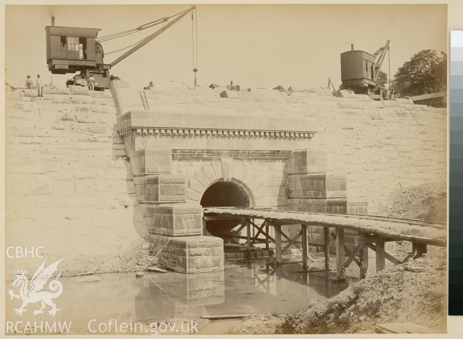 Digital copy of an albumen print from Edward Hubbard Collection. Album 'Lake Vyrnwy Photographs' print entitled 'The Vyrnwy Masonry Dam' showing the back wall at the northeast end taken June 1886.